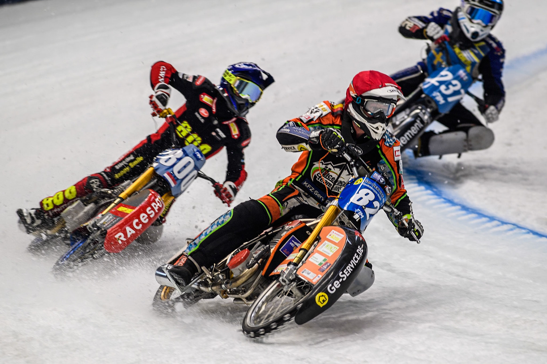 Germany's Markus Jell (82) (Red) leads  Netherlands' Jasper Iwema (800) (Blue) and Sweden's Jimmy Hörnell Lidfalk (237) (White) during the FIM Ice Speedway Gladiators World Championship Final 2 at the Max-Aicher-Arena, Inzell on Sunday 24 March 2024. (Photo: Ian Charles | MI News)