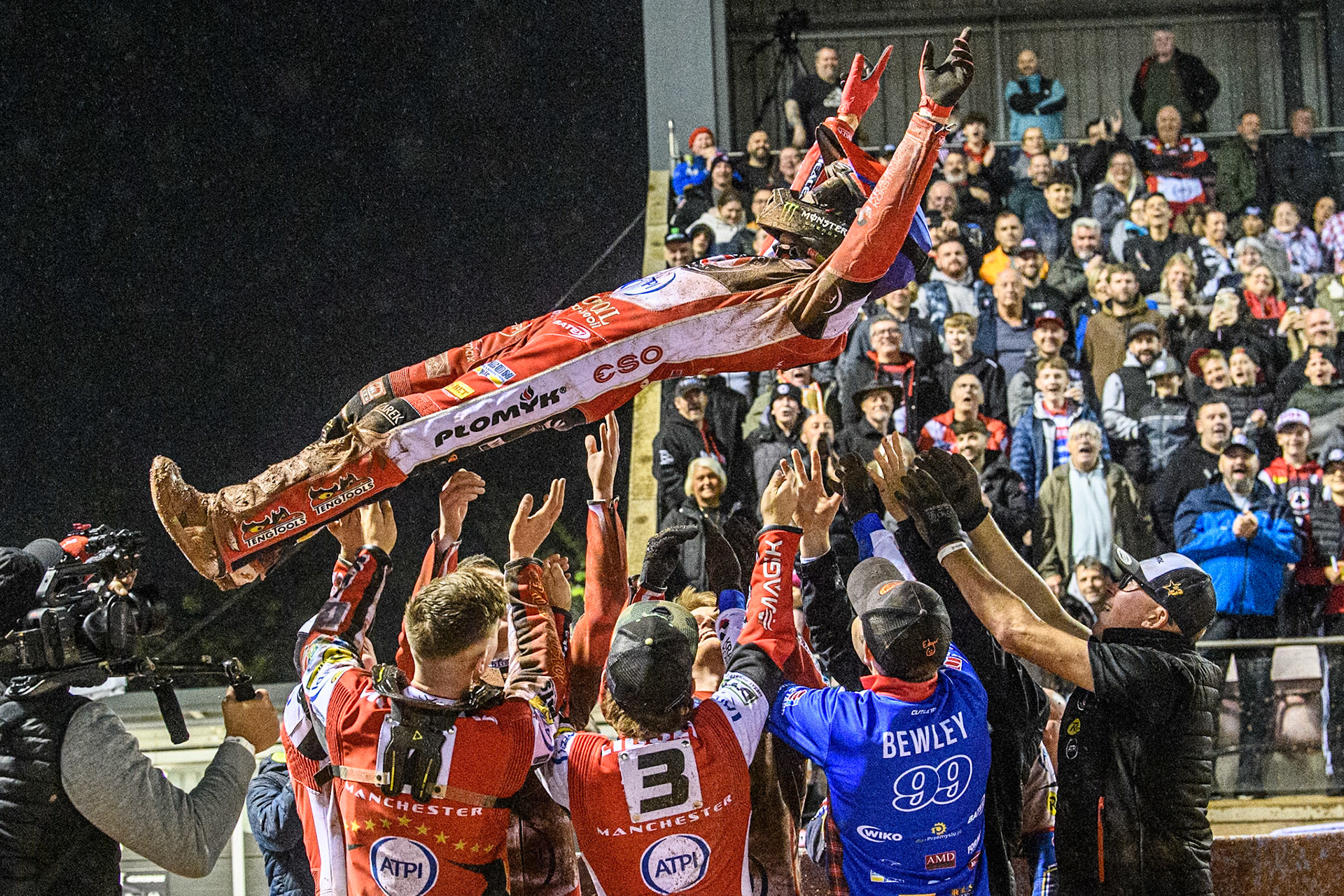 Belle Vue Aces' Dan Bewley  gets the bumps from his team mates after his full maximum score during the Rowe Motor Oil Premiership Grand Final 1st Leg between Belle Vue Aces and Leicester Lions at the National Speedway Stadium, Manchester on Monday 23rd September 2024. (Photo: Ian Charles | MI News)