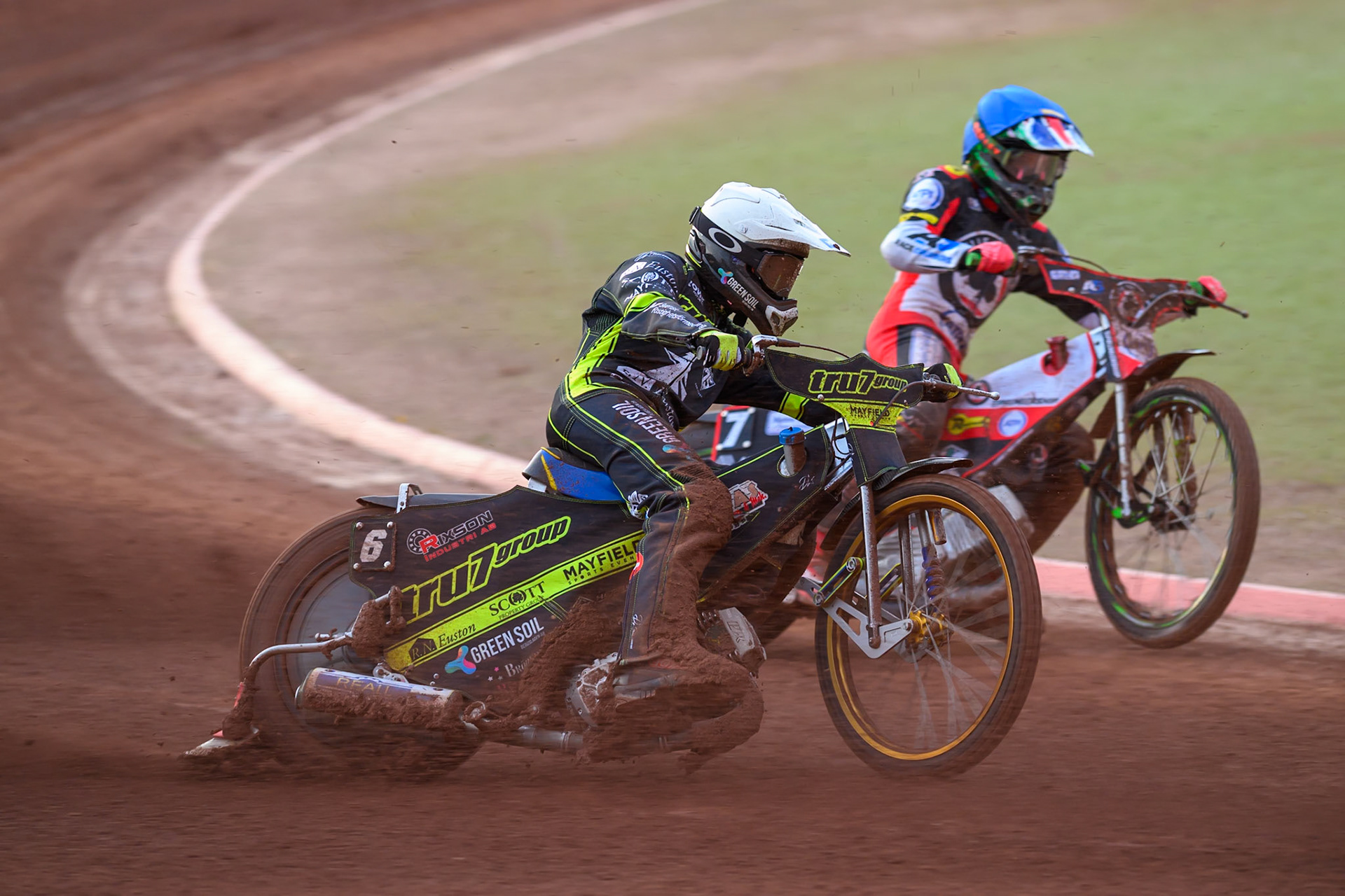 Philip Hellstrom-Bangs of Ipswich Witches  in White rides outside Will Cairns of Belle Vue Aces  in Blue during the Rowe Motor Oil Premiership match between Belle Vue Aces and Ipswich Witches at the National Speedway Stadium, Manchester on Monday 20th April 2026. (Photo: Ian Charles | MI News)