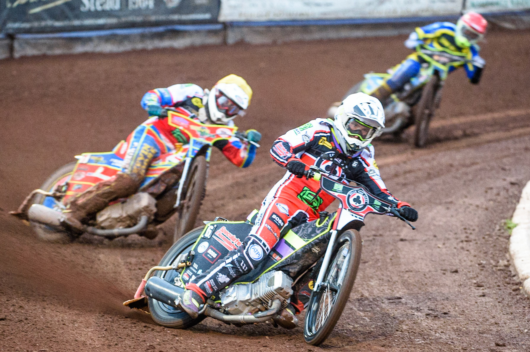 SHEFFIELD, UK. AUG 2NDTom Brennan  (White) and Simon Lambert  (Yellow) lead Danyon Hume  (Red) during the SGB Premiership match between Sheffield Tigers and Belle Vue Aces at Owlerton Stadium, Sheffield on Thursday 2nd September 2021. (Credit: Ian Charles | MI News)
