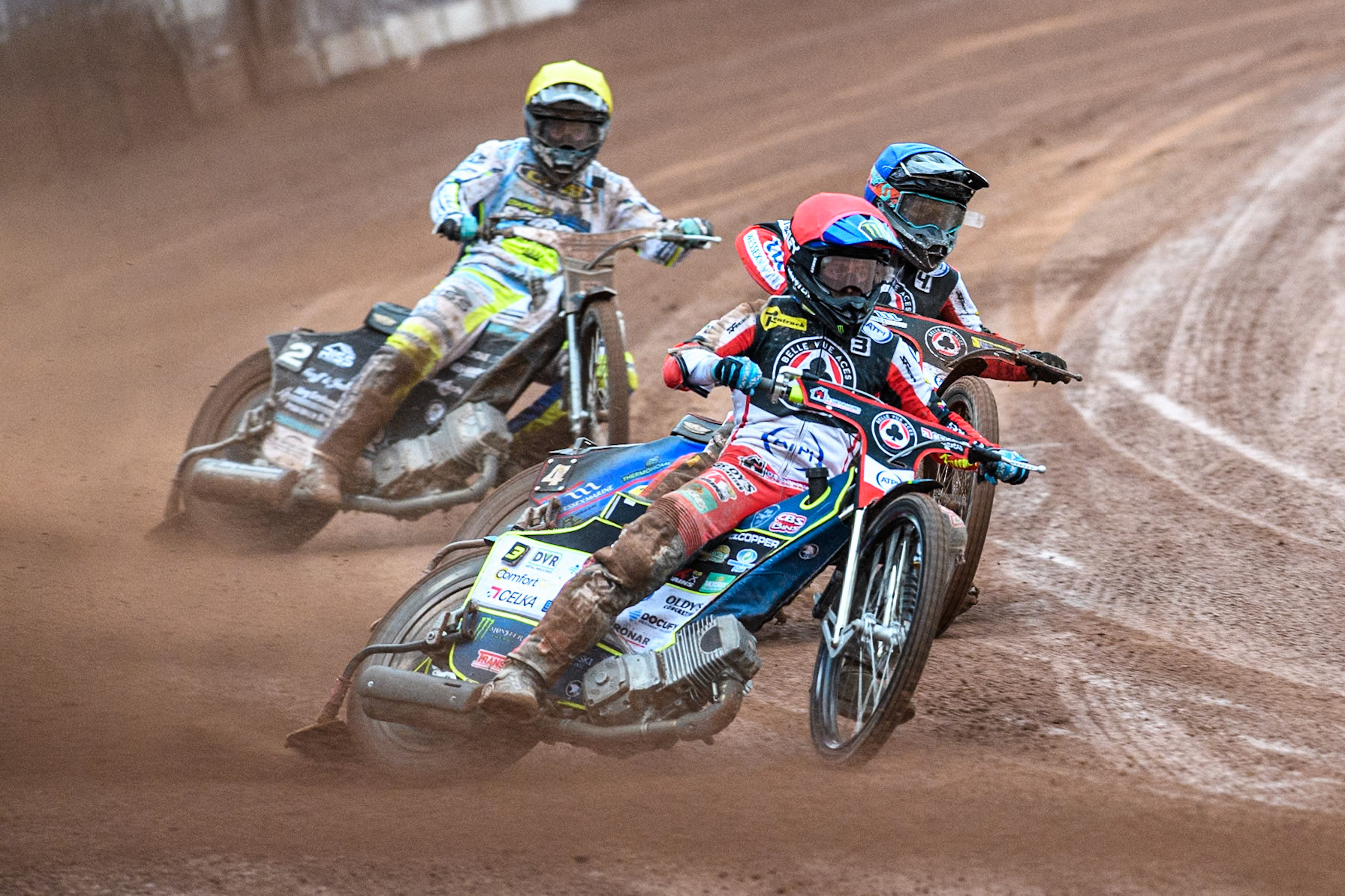 Belle Vue Aces' Jaimon Lidsey  in Red leading Belle Vue Aces' Ben Cook  in Blue and Oxford Spires' Erik Riss  in Yellow during the Rowe Motor Oil Premiership match between Belle Vue Aces and Oxford Spires at the National Speedway Stadium, Manchester on Monday 22nd July 2024. (Photo: Ian Charles | MI News)