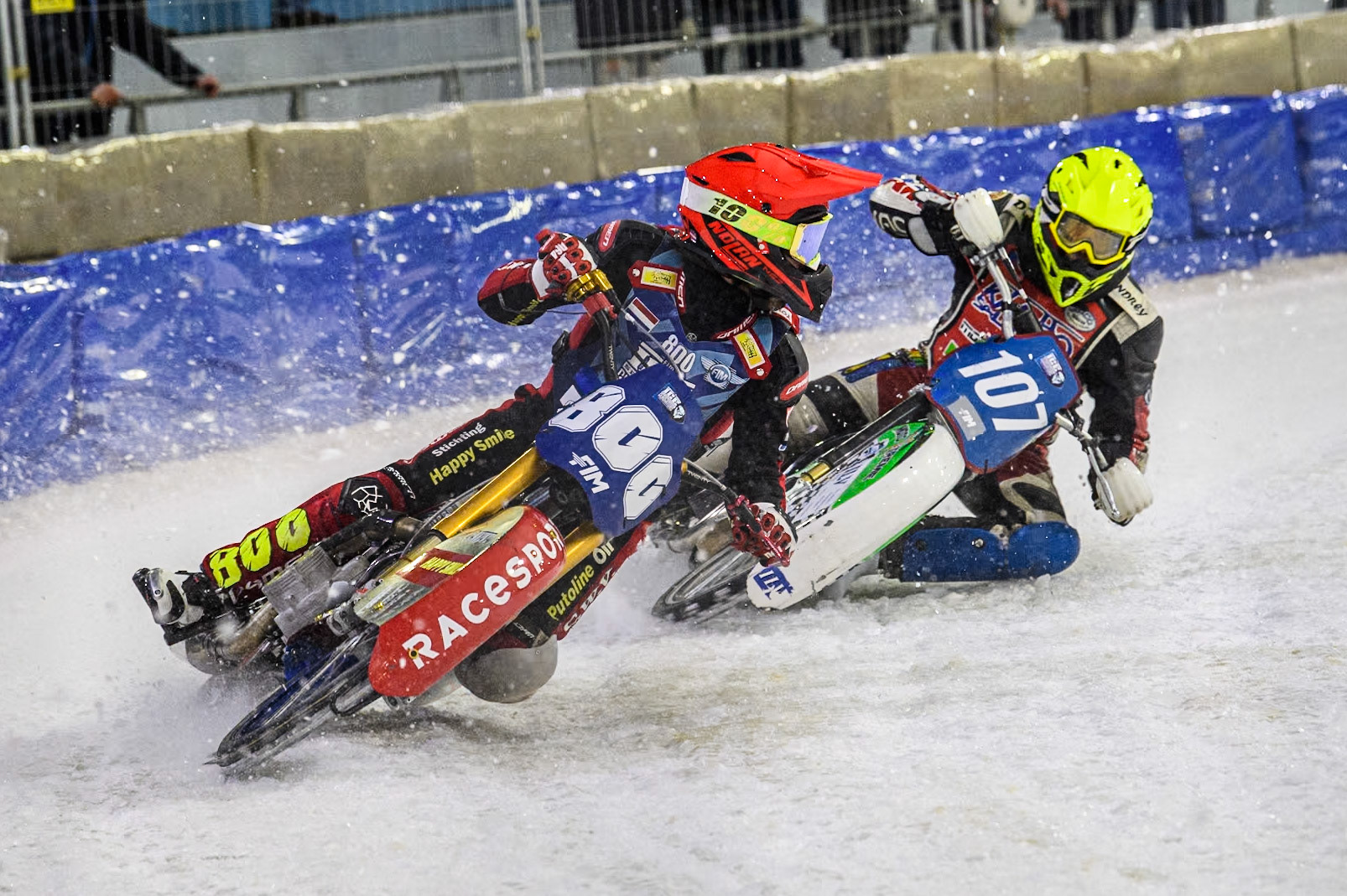 Netherlands' Jasper Iwema (800) in Red looks behind for Czech Republic's Andrej Diviš (107) in Yellow during the FIM Ice Speedway Gladiators World Championship Final 4 at Ice Rink Thialf, Heerenveen on Sunday 7th April 2024. (Photo: Ian Charles | MI News)