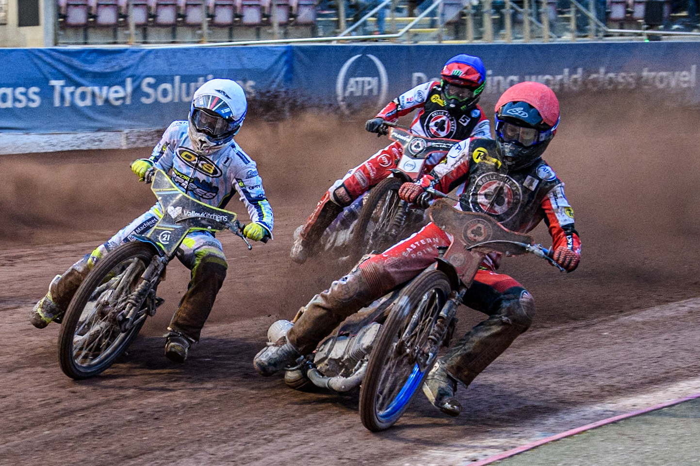 Belle Vue Aces' Brady Kurtz in Red rides inside Oxford Spires' Rohan Tungate in White with Belle Vue Aces' Dan Bewley in Blue behind during the Rowe Motor Oil Premiership match between Belle Vue Aces and Oxford Spires at the National Speedway Stadium, Manchester on Monday 13th May 2024. (Photo: Ian Charles | MI News)