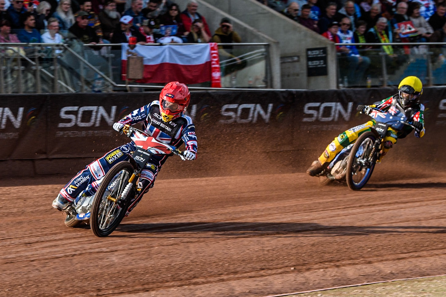Robert Lambert of Great Britain in Red leading Brady Kurtz of Australia in Yellow during the Monster Energy FIM Speedway of Nation Final at the National Speedway Stadium, Manchester on Saturday 13th July 2024. (Photo: Ian Charles | MI News)