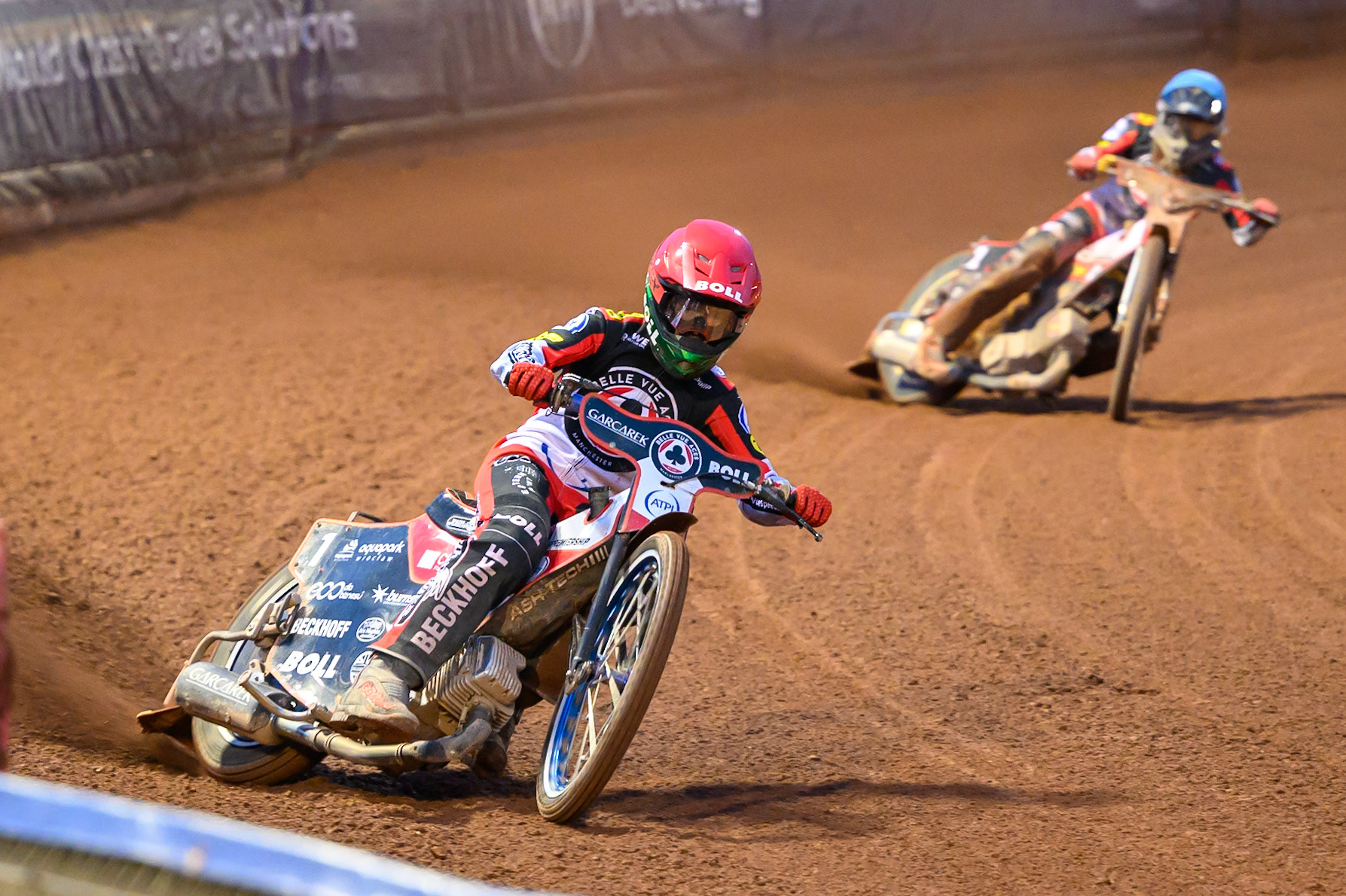 Brady Kurtz of Belle Vue Aces  in Red leading Norick Blödorn of Belle Vue Aces  in Blue during the Rowe Motor Oil Premiership match between Belle Vue Aces and Ipswich Witches at the National Speedway Stadium, Manchester on Monday 20th April 2026. (Photo: Ian Charles | MI News)