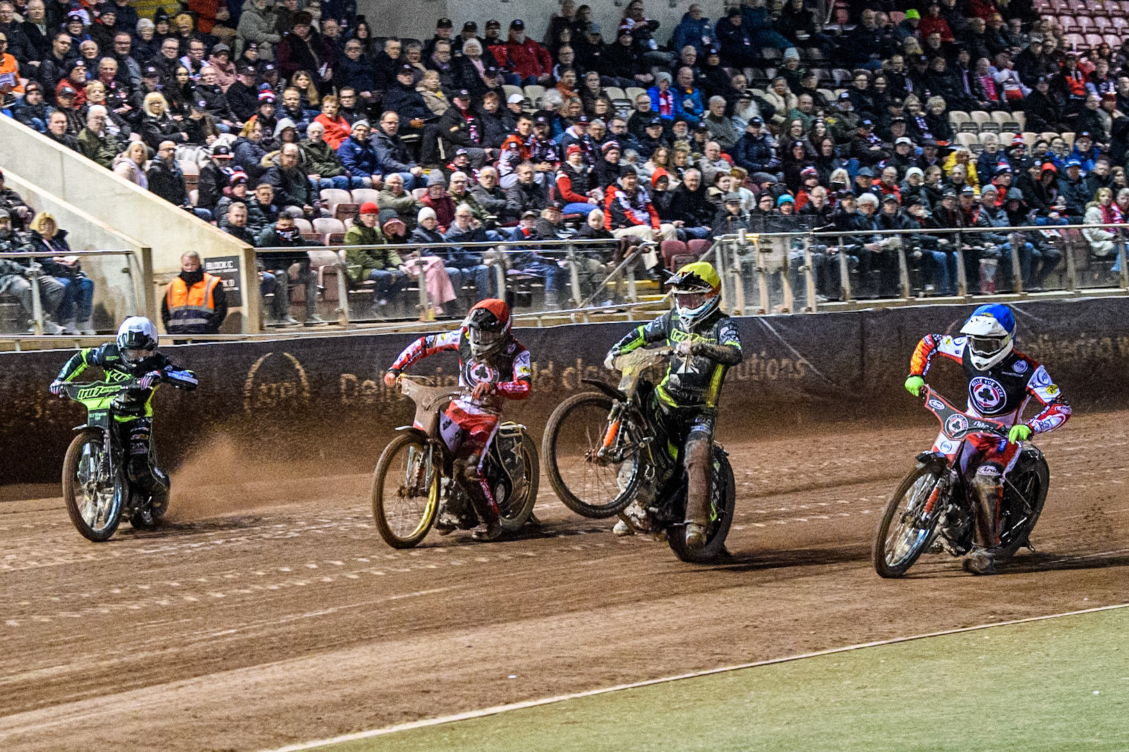 (L to R): Danny King of Ipswich Witches in White, Norick Blödorn of Belle Vue Aces in Red Jordan Jenkins of Ipswich Witches and Jake Mulford of Belle Vue Aces in Blue leave the start during the Premiership Cup Quarter Final 1st Leg match between Belle Vue Aces and Ipswich Witches at the National Speedway Stadium, Manchester on Monday 24th March 2025. (Photo: Ian Charles | MI News)