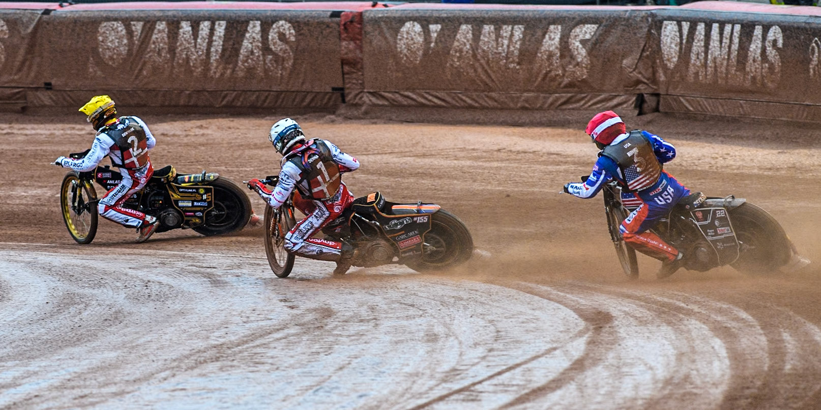 Mikkel Michelsen of Denmark in White passes Broc Nicol of the USA in Red with Anders Thomsen of Denmark in Yellow leading during the Monster Energy FIM Speedway of Nation Semi Final 2 at the National Speedway Stadium, Manchester on Wednesday 10th July 2024. (Photo: Ian Charles | MI News)
