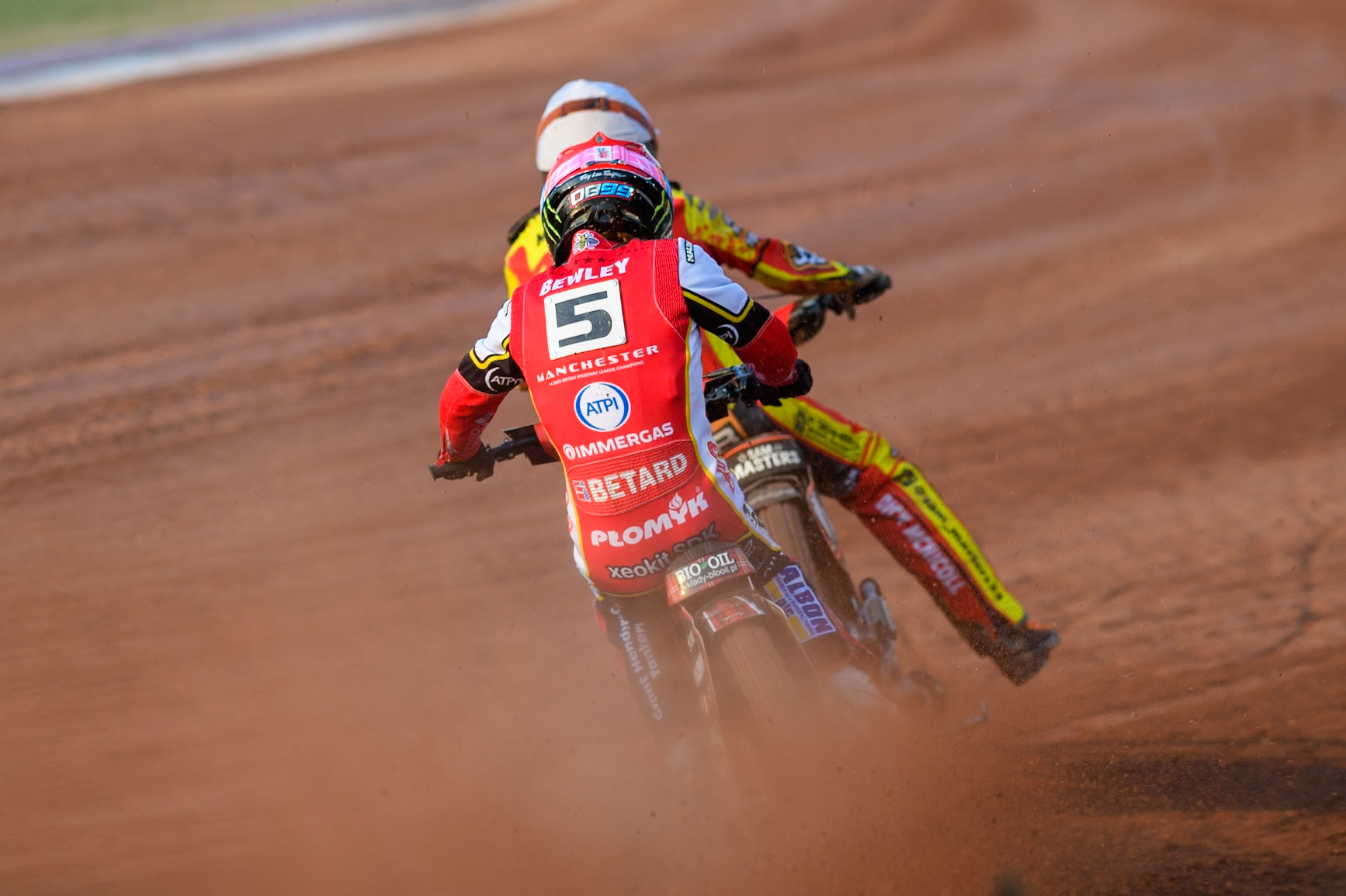 Belle Vue Aces' Dan Bewley in Red chases Leicester Lions' Sam Masters in White during the Rowe Motor Oil Premiership match between Belle Vue Aces and Leicester Lions at the National Speedway Stadium, Manchester on Monday 19th May 2025. (Photo: Ian Charles | MI News)