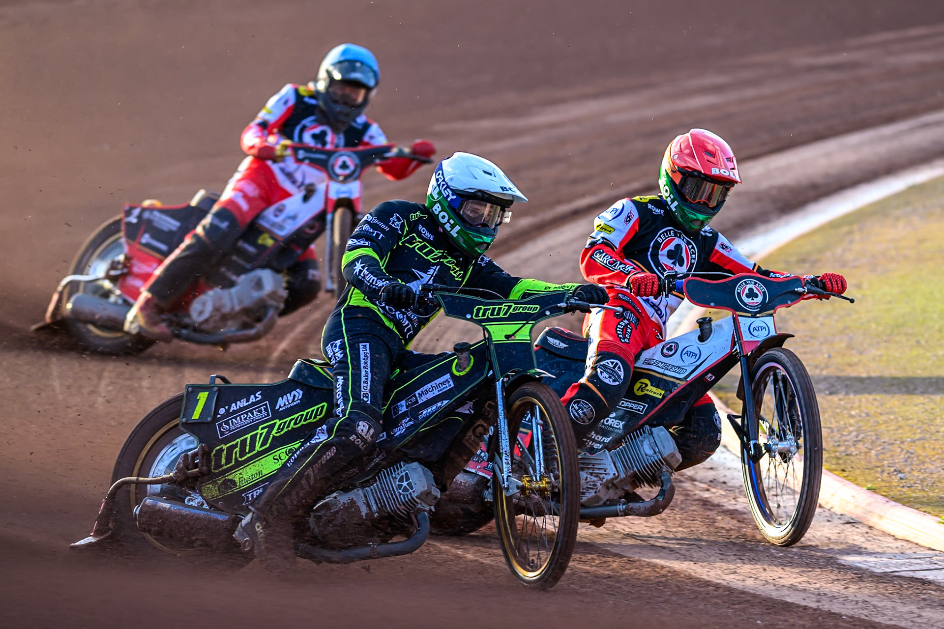 Jason Doyle of Ipswich Witches  in White rides outside Brady Kurtz of Belle Vue Aces  in Red with Norick Blödorn of Belle Vue Aces  in Blue behind during the Rowe Motor Oil Premiership match between Belle Vue Aces and Ipswich Witches at the National Speedway Stadium, Manchester on Monday 4th August 2025. (Photo: Ian Charles | MI News)