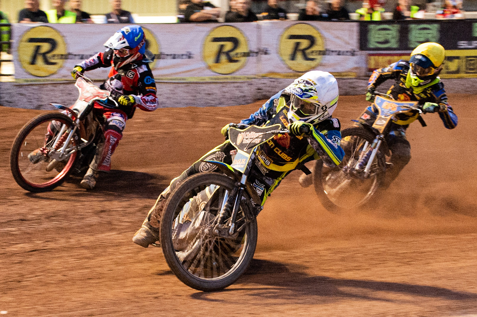 Photo: Ian Charles

Danyon Hume  (White) and Anders Rowe  (Yellow) inside Connor Bailey  (Blue) 

Belle Vue Colts v Leicester Cubs, SGB National League, Belle Vue National Speedway Stadium, Manchester, Thursday 8  August  2019
