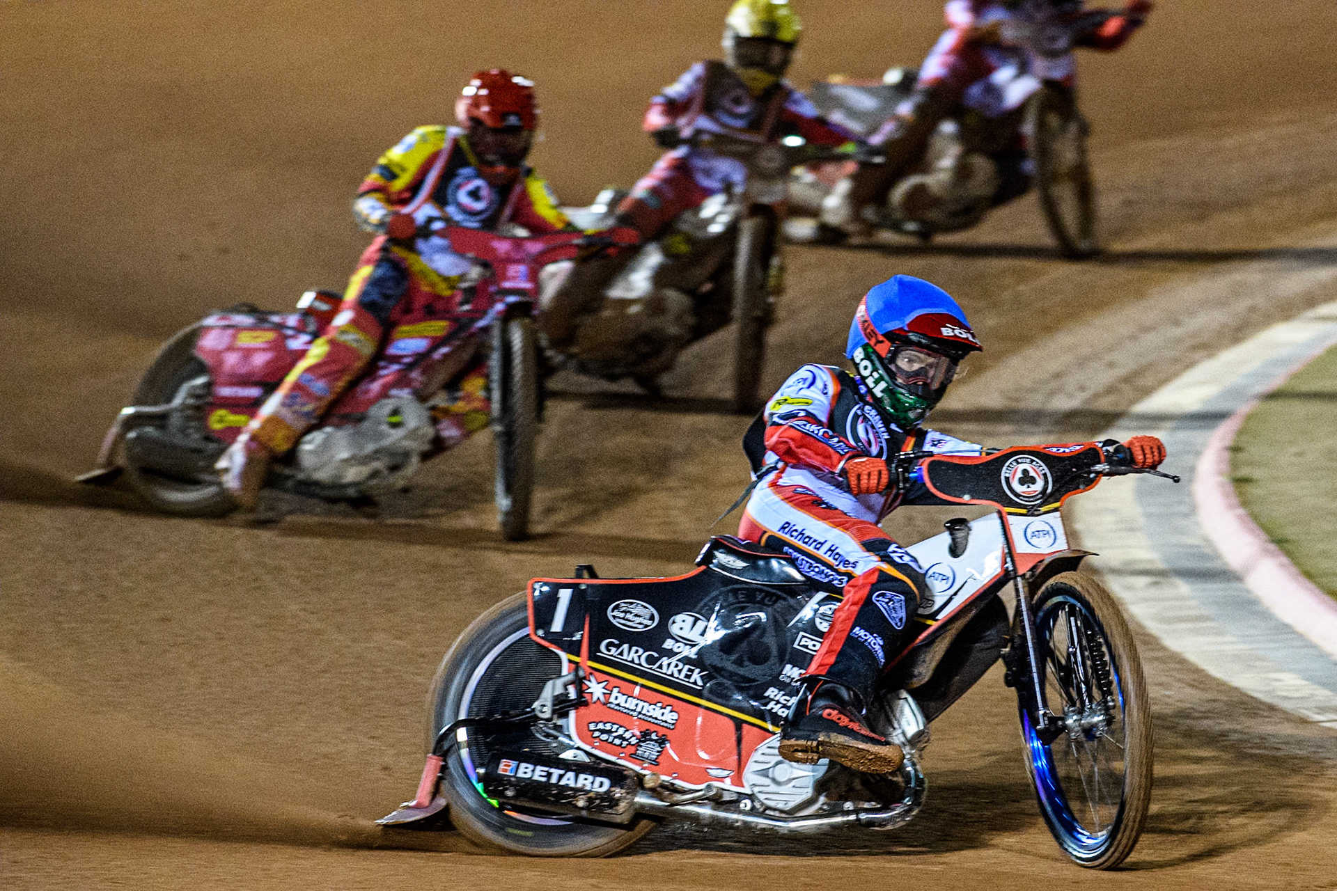 Brady Kurtz in Blue leading Max Fricke in Red and Jaimon Lidsey in Yellow during the Peter Craven Memorial Trophy at the National Speedway Stadium, Manchester on Monday 17th March 2025. (Photo: Ian Charles | MI News)