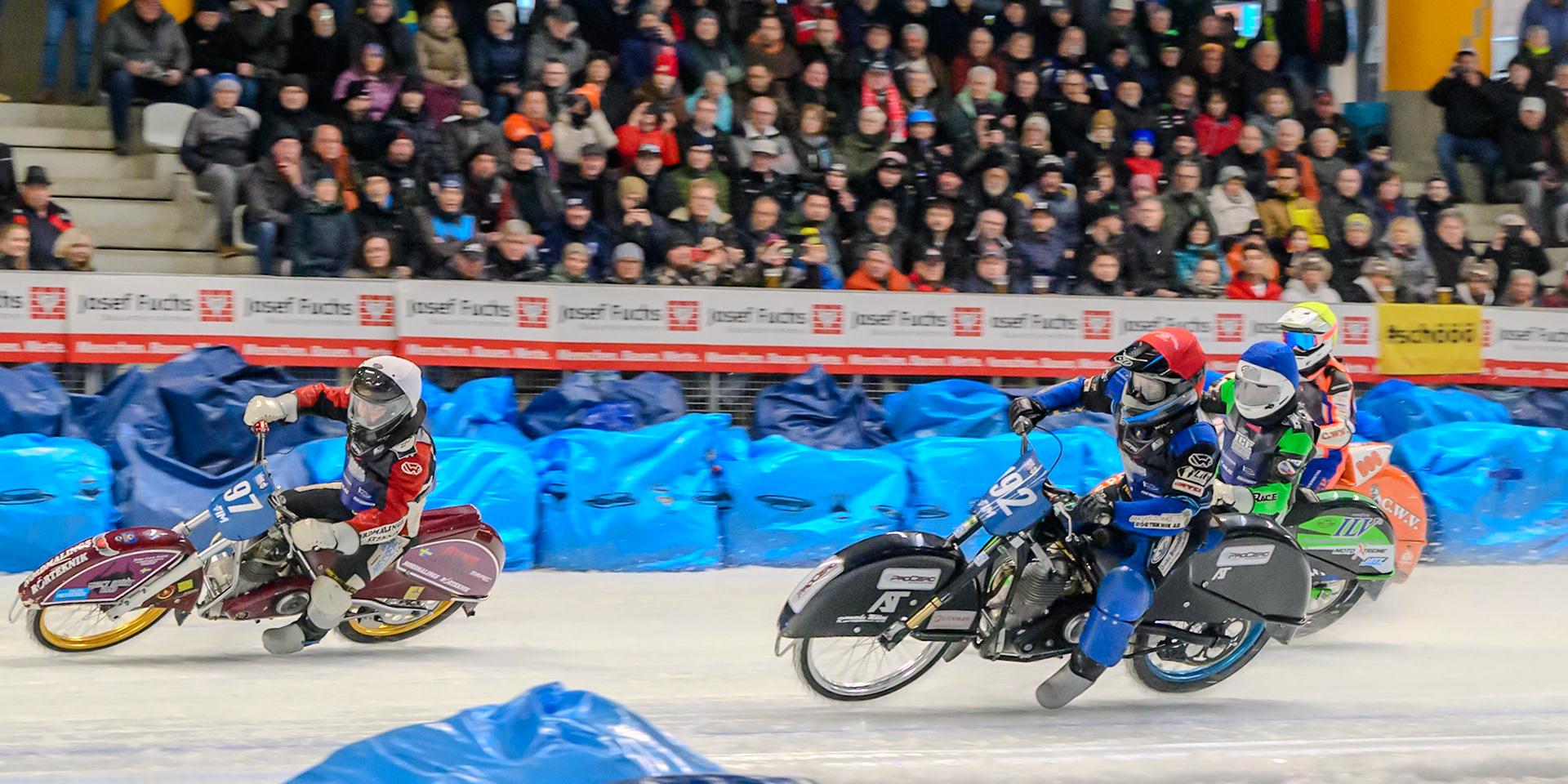 Niclas Svensson (192) of Sweden  in Red rides inside Ove Ledström (97) of Sweden in White with Andrej Divis (107) of Czechia b\ and Jasper Iwema (800) of The Netherlands in Yellow behind during the Ice Speedway Gladiators World Championship Final 2 at Max-Aicher-Arena, Inzell on Sunday 15th March 2026. (Photo: Ian Charles | MI News)