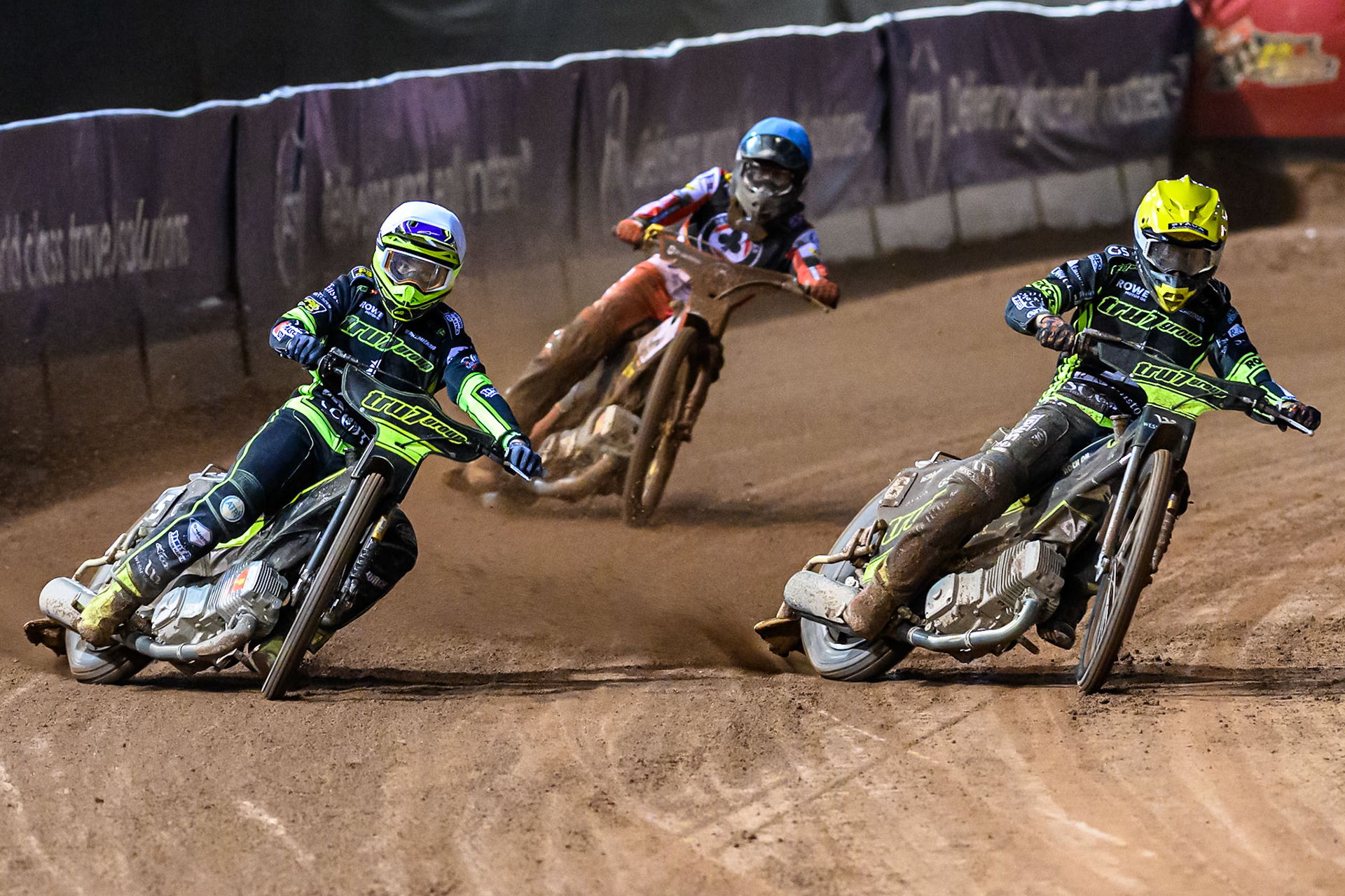 Tom Brennan of Ipswich Witches  in White and Adam Ellis of Ipswich Witches  in Yellow leading Norick Blödorn of Belle Vue Aces  in Blue during the Rowe Motor Oil Premiership Play Off Semi Final 1 (1st Leg)  between Belle Vue Aces and Ipswich Witches at the National Speedway Stadium, Manchester on Monday 8th September 2025. (Photo: Ian Charles | MI News)