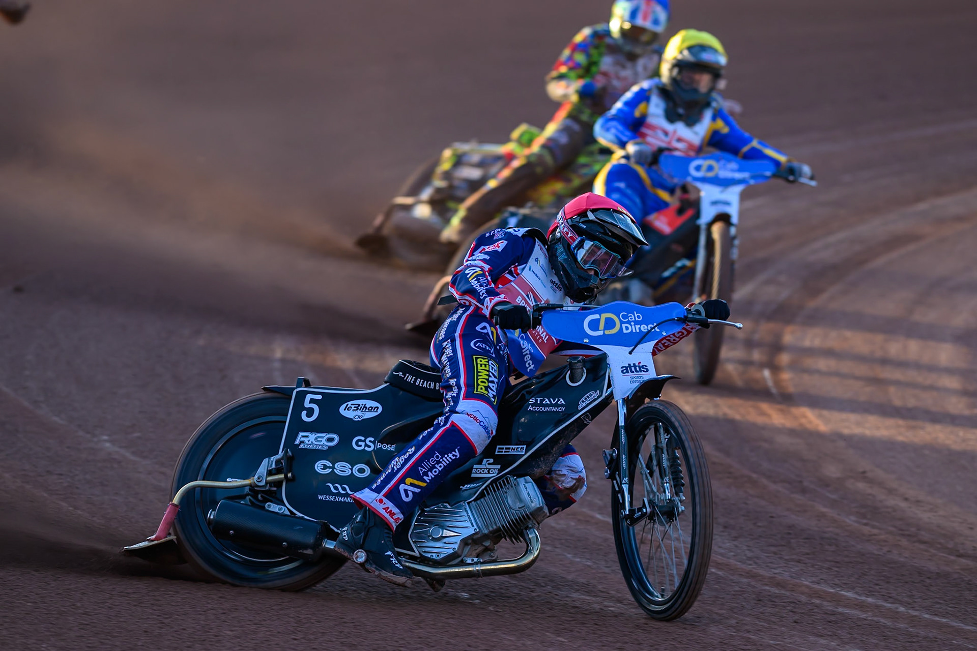 Adam Ellis (5) in Red leading Dan Thompson (8) in Yellow and Will Cairns (7) in Blue during the Cab Direct British Speedway Championship Final at the National Speedway Stadium, Manchester on Saturday 15th August 2026. (Photo: Ian Charles | MI News)