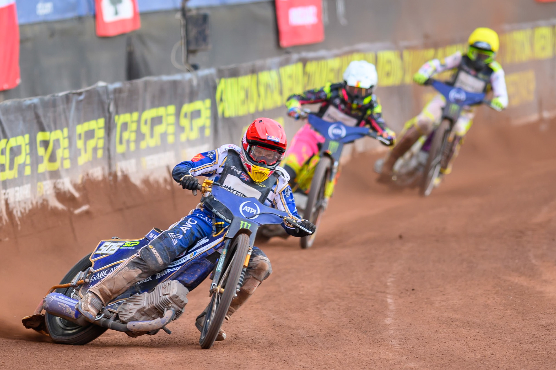 Robert Lambert (505) of Great Britain in Red leading Michael Jepsen Jensen (52) of Denmark in White and Wild Card Tom Brennan (16) of Great Britain in Yellow during the ATPI  FIM Speedway GP of Manchester at the National Speedway Stadium, Manchester on Friday 5th June 2026. (Photo: Ian Charles | MI News)