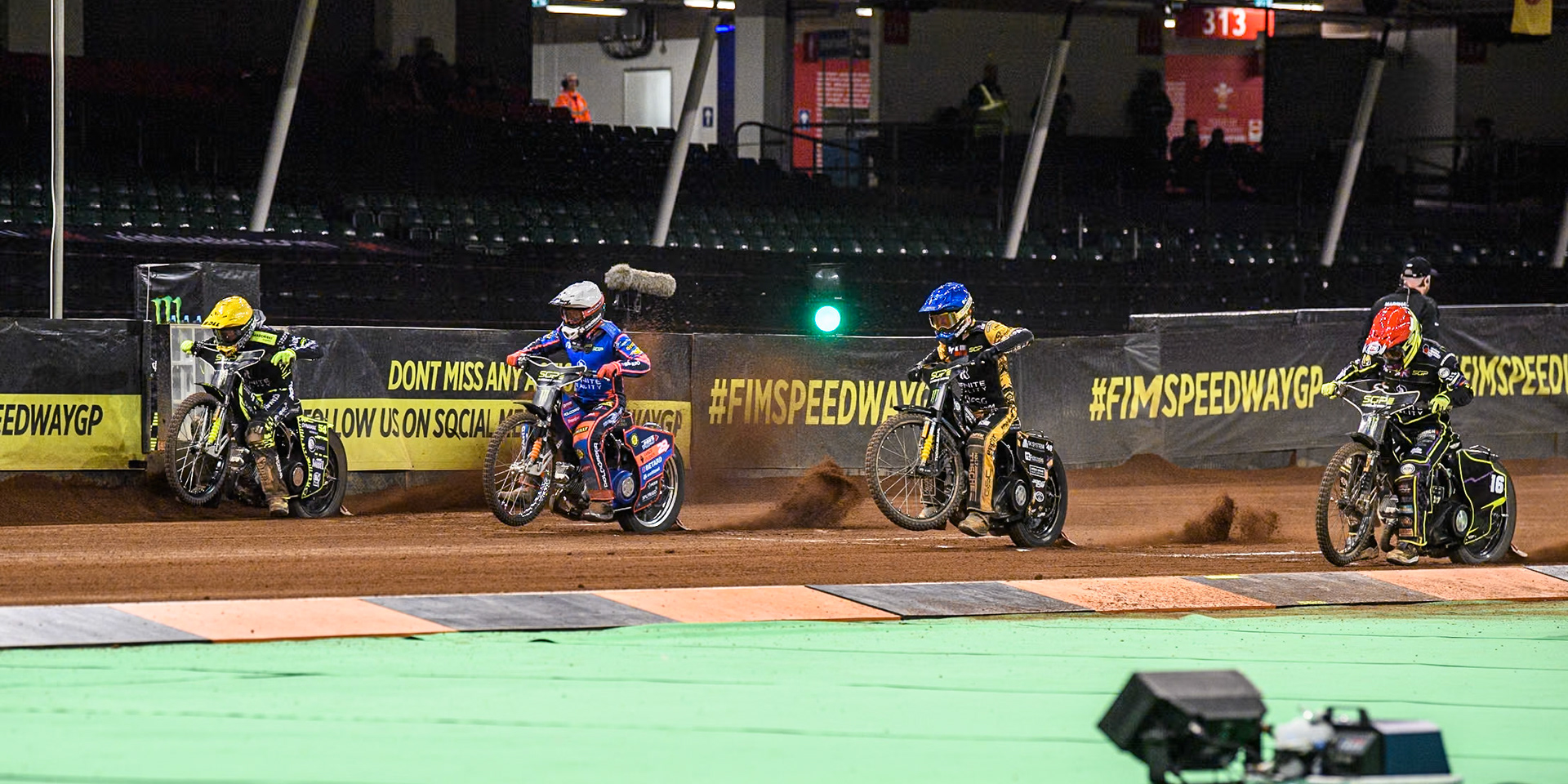 (L to R) Martin Vaculik (54) of Slovakia in Yellow Andzejs Lebedevs (29) of Latvia in White,  Szymon Woźniak (48) of Poland in Blue and Tom Brennan (16) Wild card rider of Great Britain in Red during the FIM Speedway Grand Prix of Great Britain at The Principality Stadium, Cardiff on Saturday 17th August 2024. (Photo: Ian Charles | MI News)