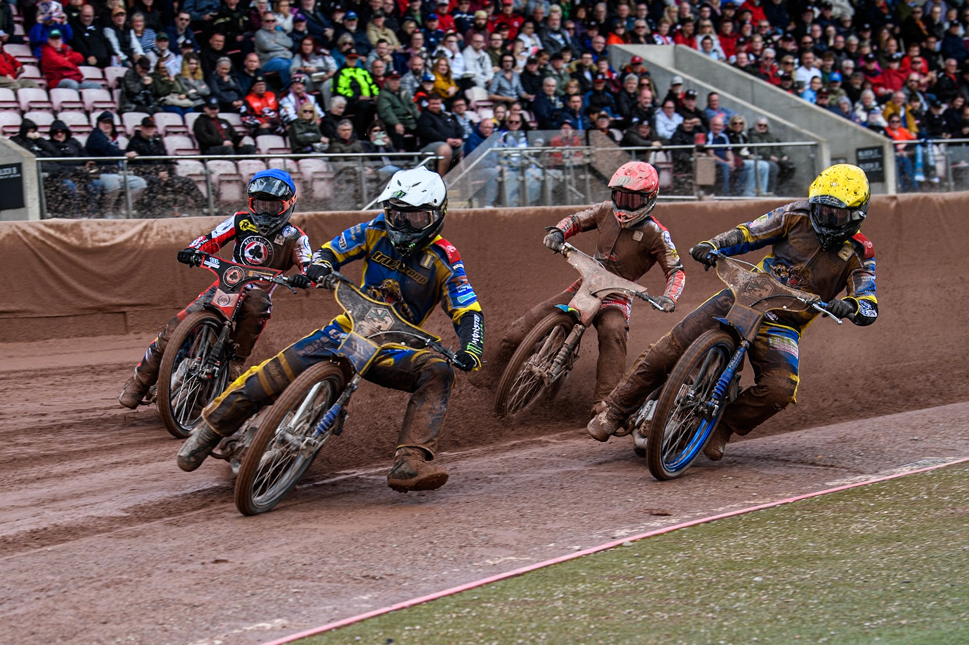 Sheffield Tigers' Jack Holder in White and Sheffield Tigers' Kyle Howarth in Yellow leading Belle Vue Aces' Jaimon Lidsey in Red and Belle Vue Aces' Ben Cook in Blue during the Rowe Motor Oil Premiership match between Belle Vue Aces and Sheffield Tigers at the National Speedway Stadium, Manchester on Monday 27th May 2024. (Photo: Ian Charles | MI News)