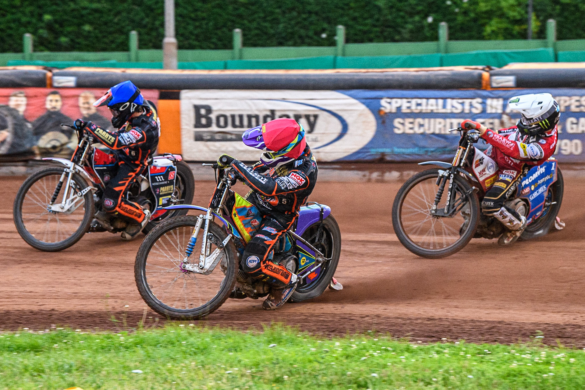 Zach Cook (Blue) and Rory Schlein (Red) lead Dan Bewley (White) during the Sports Insure Premiership match between Wolverhampton Wolves and Belle Vue Aces at Monmore Green Stadium, Wolverhampton on Monday 10th July 2023. (Photo: Ian Charles | MI News)