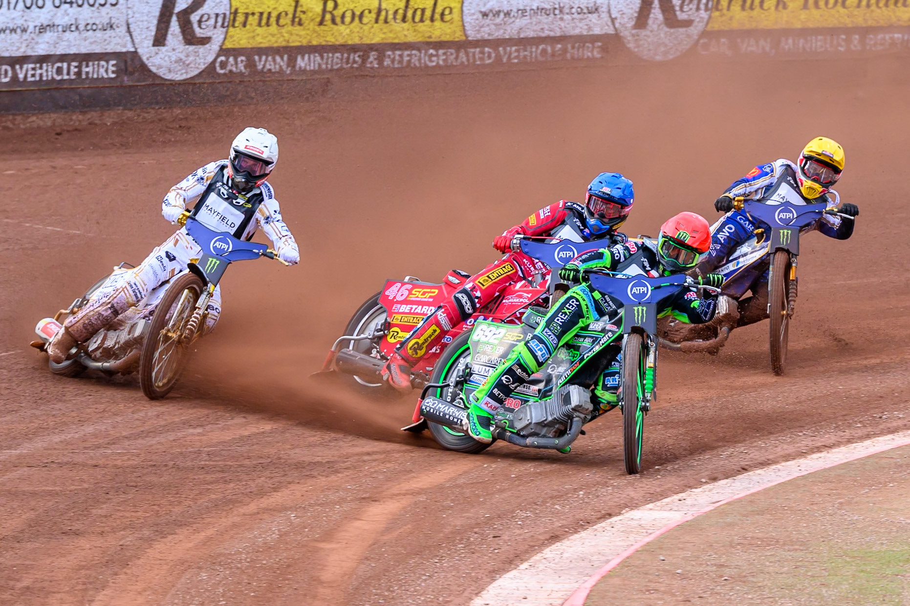 Patryk Dudek (692) of Poland in Red leading Max Fricke (46) of Australia in Blue Anders Thomsen (105) of Denmark in White and Robert Lambert (505) of Great Britain in Yellow during the ATPI  FIM Speedway GP of Manchester at the National Speedway Stadium, Manchester on Friday 5th June 2026. (Photo: Ian Charles | MI News)