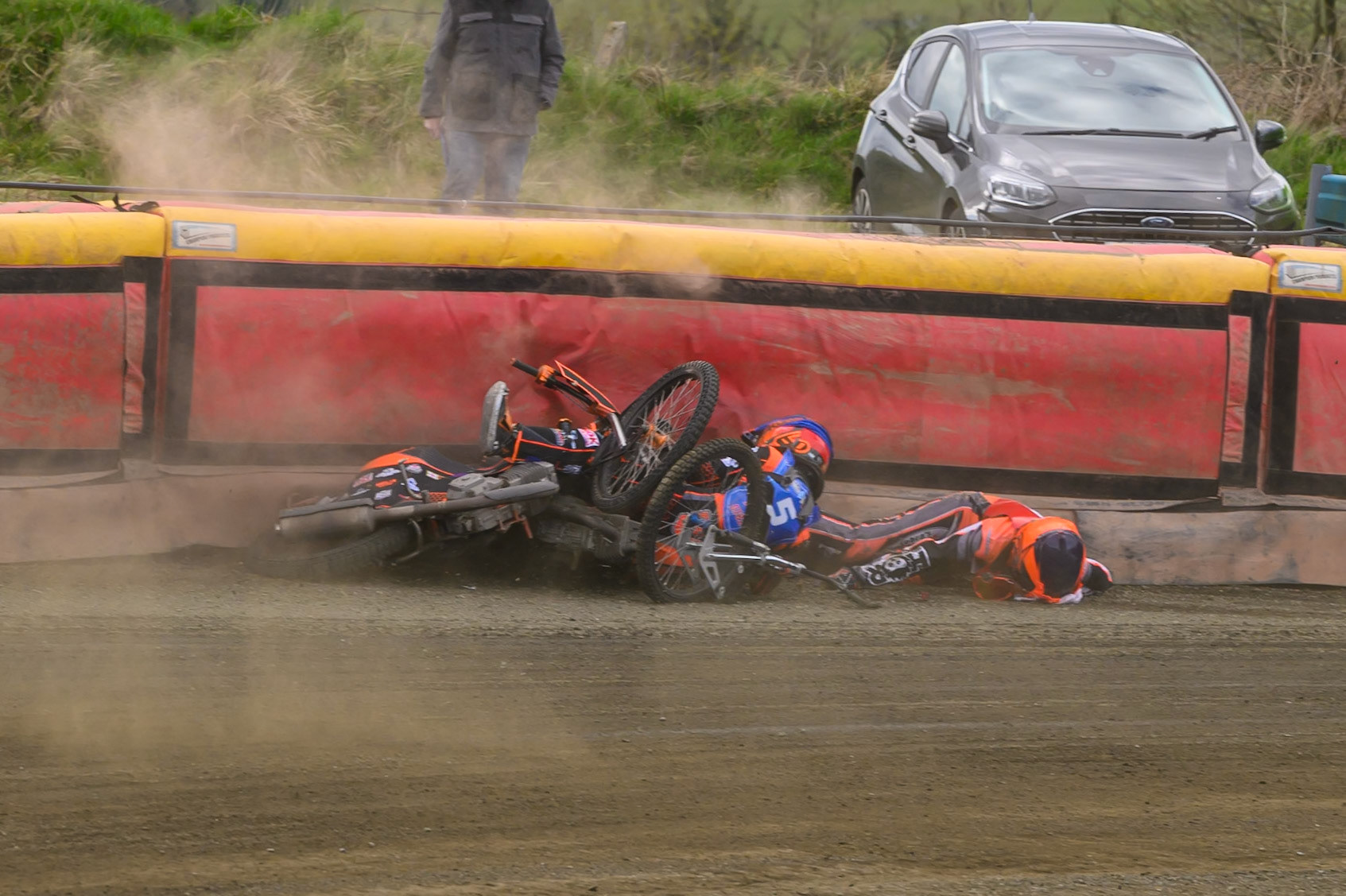 Connor Coles of NDL Nomads   in White fall and Jack Smith of Buxton Bulls   in Blue collides with him during the  Challenge match between Buxton Bulls and NDL Nomads at Hi-Edge Speedway, Buxton on Sunday 19th April 2026. (Photo: Ian Charles | MI News)