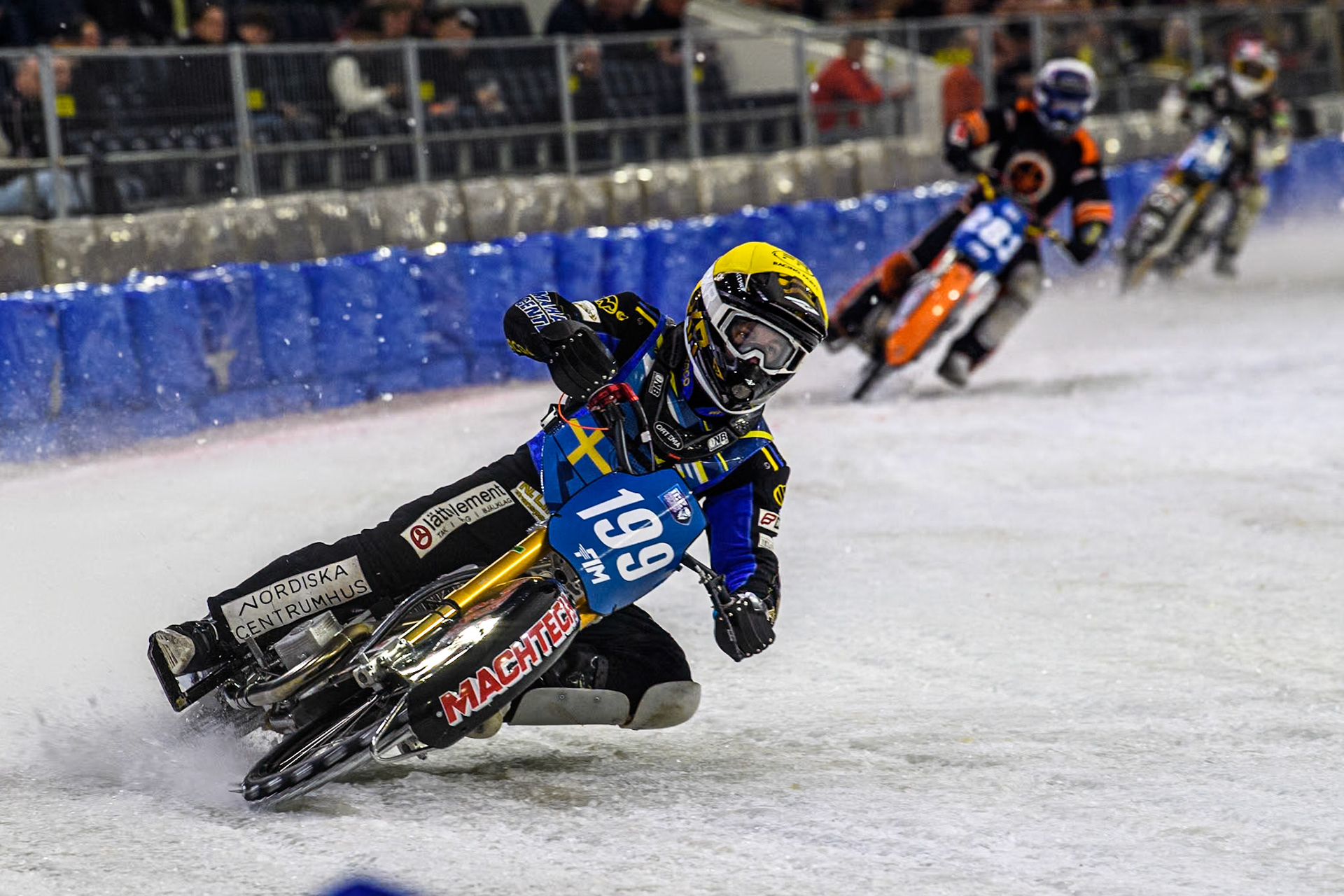 Sweden's Martin Haarahiltunen (199)  in Yellow well ahead of Netherland's Sebastian Reitsma (283) in White during the FIM Ice Speedway Gladiators World Championship Final 3 at Ice Rink Thialf, Heerenveen on Saturday 6th April 2024. (Photo: Ian Charles | MI News)
