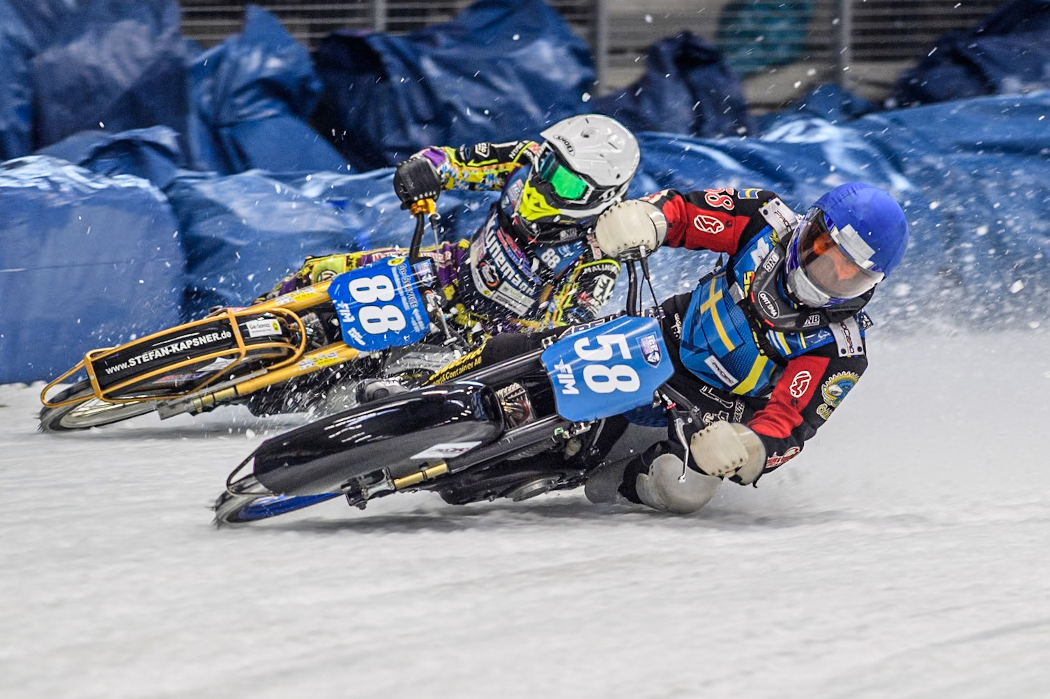 Sweden's Stefan Svensson (58) (Blue) leads  Germany's Max Niedermaier (88) (White) during the FIM Ice Speedway Gladiators World Championship Final 2 at the Max-Aicher-Arena, Inzell on Sunday 24 March 2024. (Photo: Ian Charles | MI News)