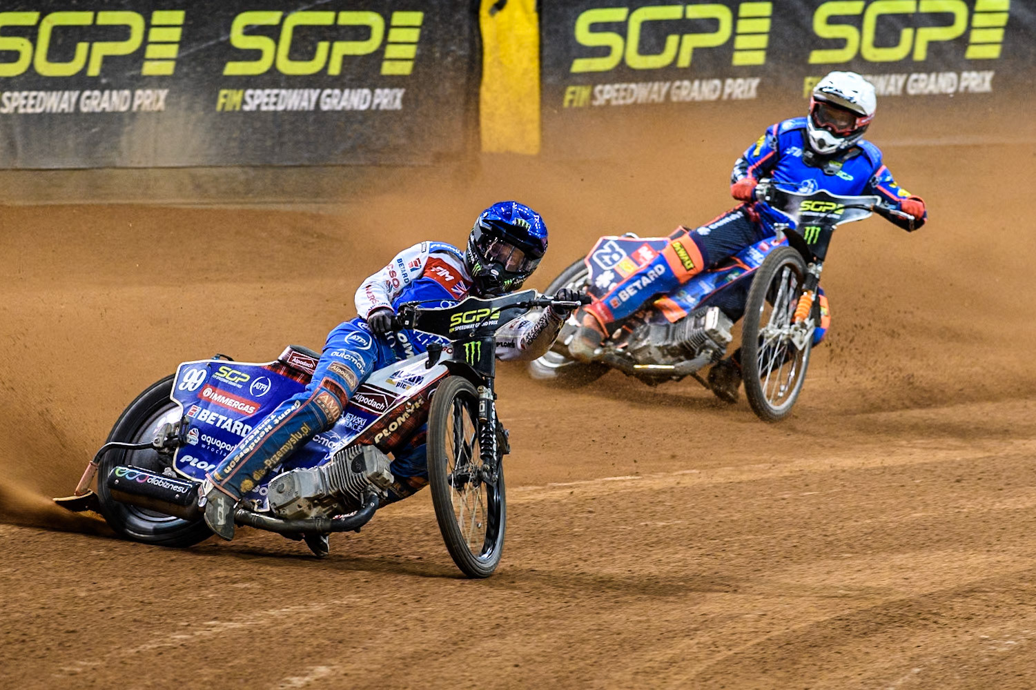 Semi Final 2: Daniel Bewley (99) of Great Britain in Blue leading Andzejs Lebedevs (29) of Latvia in White during the FIM Speedway Grand Prix of Great Britain at The Principality Stadium, Cardiff on Saturday 17th August 2024. (Photo: Ian Charles | MI News)