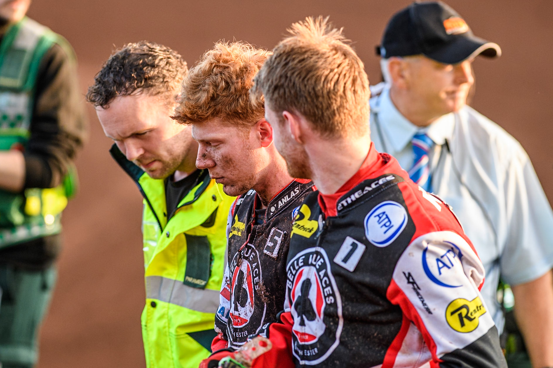 Belle Vue Aces' Dan Bewley (Centre) is helped back to the pits after his crash by Belle Vue Aces' Brady Kurtz (Right) and the Paramedic during the Rowe Motor Oil Premiership match between Leicester Lions and Belle Vue Aces at the Pidcock Motorcycles Arena, Leicester on Thursday 25th July 2024. (Photo: Ian Charles | MI News)