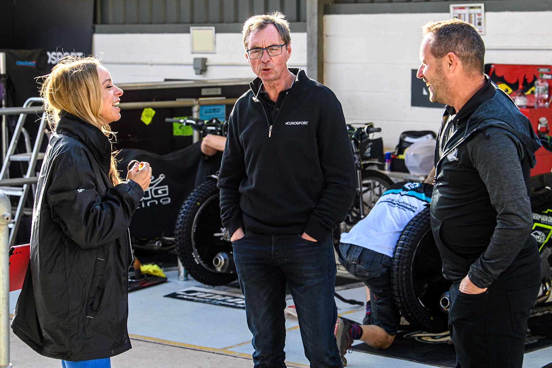 (l - r) Eurosport presenter Abi Stephens, Eurosport Commentator Kelvin Tatum and Ipswich Team Manager Chris Louis  during the Sports Insure Premiership match between Belle Vue Aces and Ipswich Witches at the National Speedway Stadium, Manchester on Monday 17th July 2023. (Photo: Ian Charles | MI News)