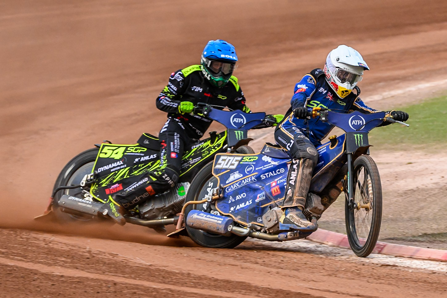Robert Lambert (505) of Great Britain in White leading Martin Vaculik (54) of Slovakia in Blue during the ATPI FIM Speedway Grand Prix Round 4 at the National Speedway Stadium, Manchester, on Friday 13th June 2025. (Photo: Ian Charles | MI News)