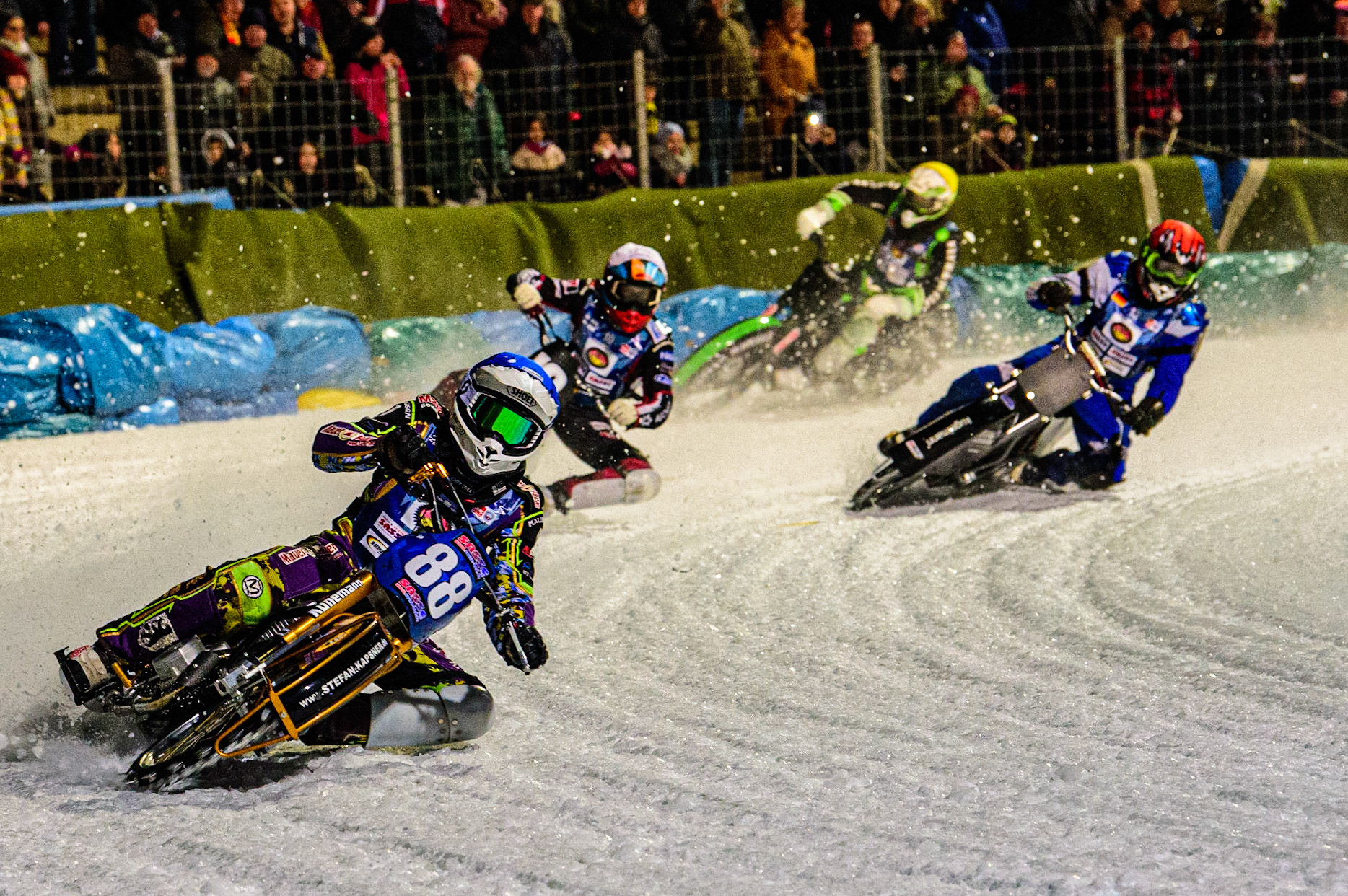Max Neidermaier (Blue) leads Topi Mustonen (White) Reinhard Greisel (Red) and Finn Loheider (Yellow) during the German Individual Ice Speedway Championship at Horst-Dohm-Eisstadion, Berlin on Friday 3rd March 2023. (Photo: Ian Charles | MI News)