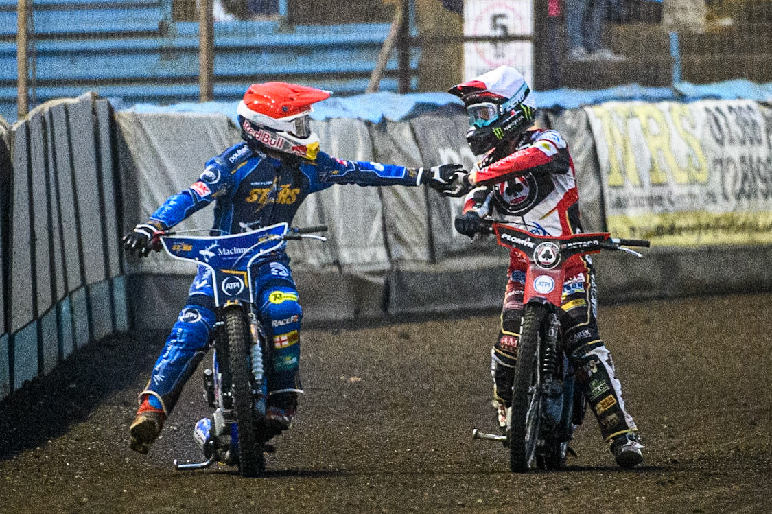 Dan Bewley (White) congratulates Robert Lambert  (Red) after a hard fought heat during the Sports Insure Premiership match between King's Lynn Stars and Belle Vue Aces at the Adrian Flux Arena, King's Lynn on Thursday 24th August 2023. (Photo: Ian Charles | MI News)