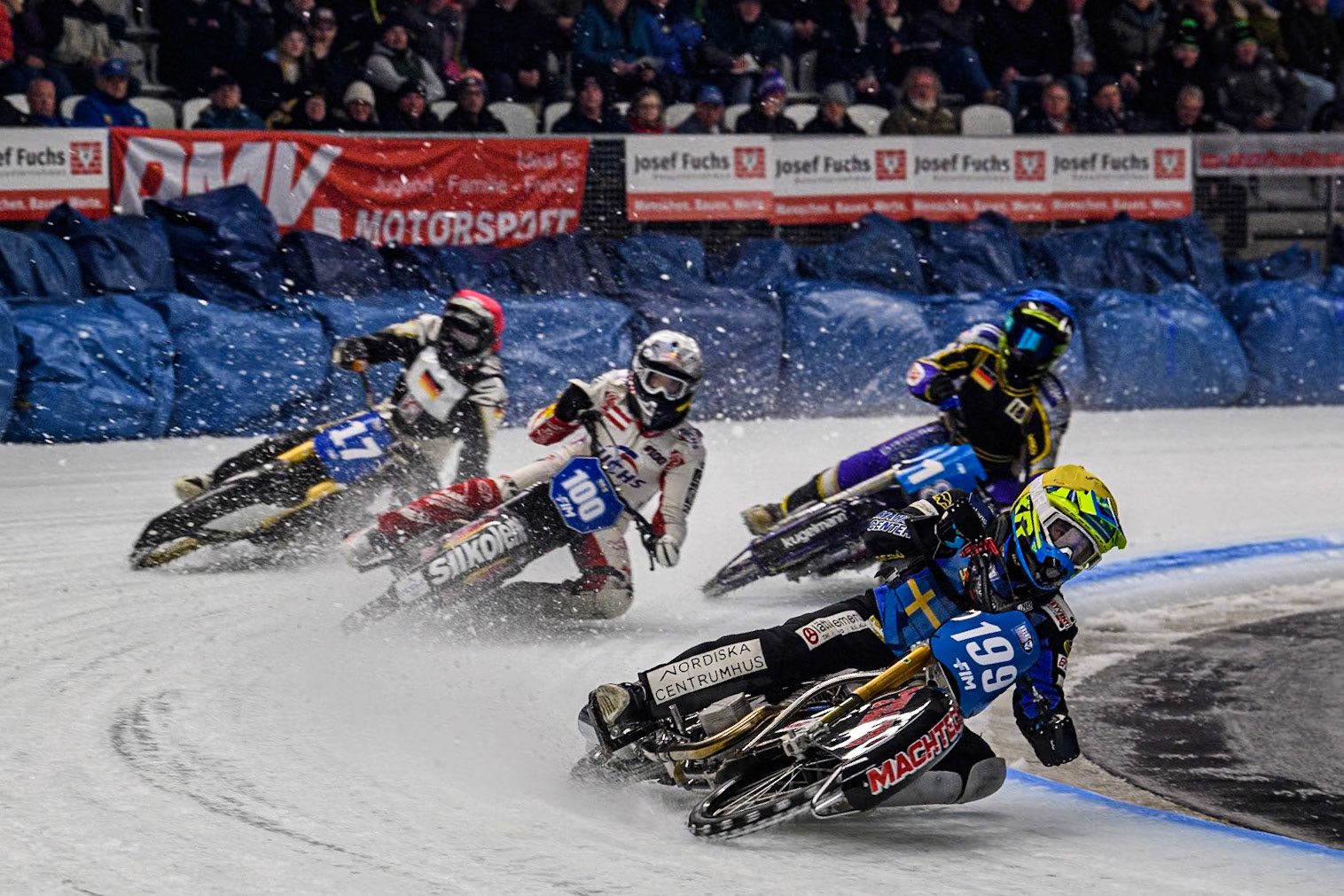 Sweden's Martin Haarahiltunen (199)  (Yellow) leads  Austria's Franz Zorn (100) (White) Germany's Franz Mayerbüchler (17) (Red) and German Reserve Christoph Kirchner (18) (Blue) during the FIM Ice Speedway Gladiators World Championship Final 1 at the Max-Aicher-Arena, Inzell on Saturday 23 March 2024. (Photo: Ian Charles | MI News)