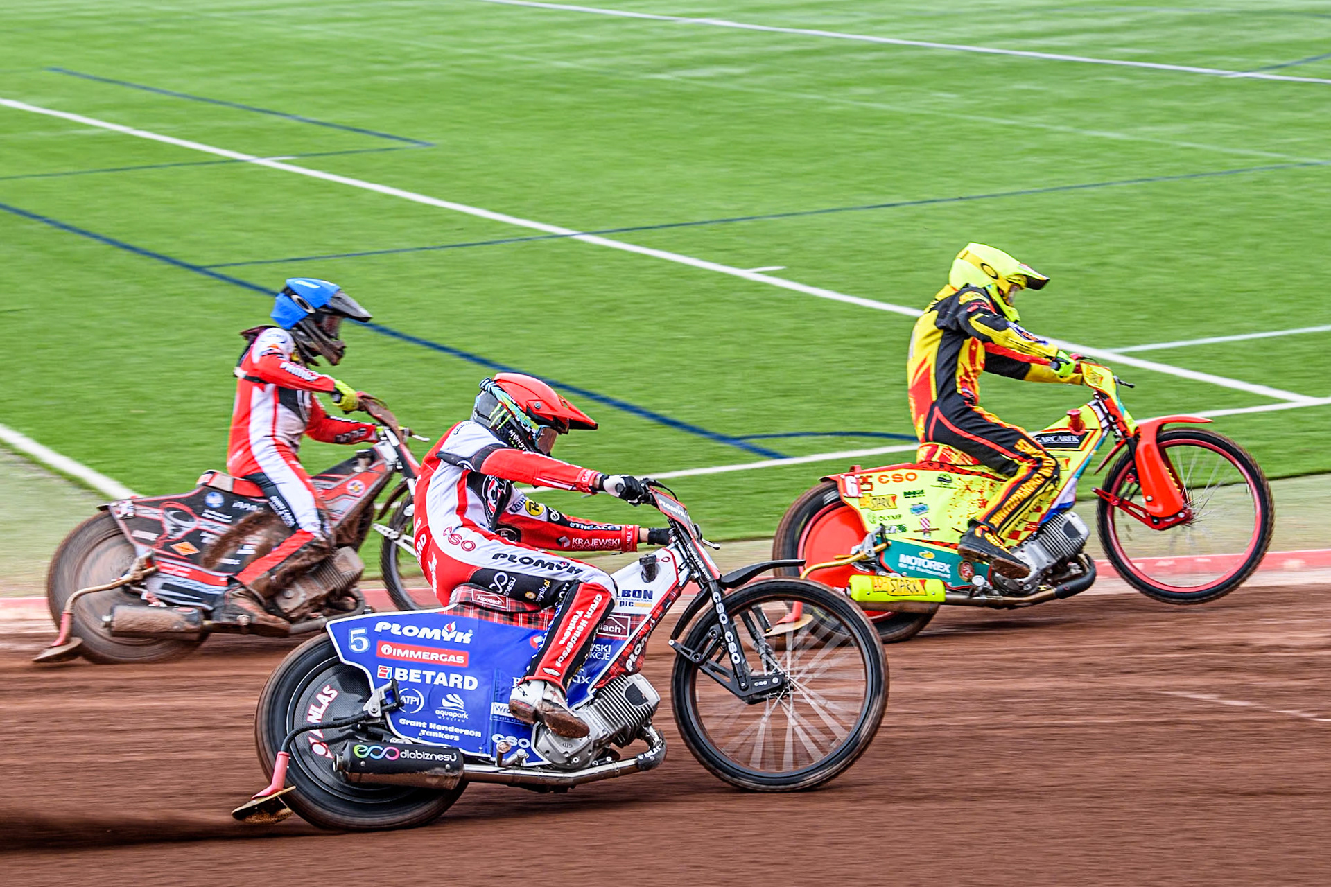 Birmingham Brummies' Vaclav Milik  in Yellow leading Belle Vue Aces' Dan Bewley  in Red and Belle Vue Aces' Connor Bailey in Blue during the Rowe Motor Oil Premiership match between Belle Vue Aces and Birmingham Brummies at the National Speedway Stadium, Manchester on Monday 6th May 2024. (Photo: Ian Charles | MI News)
