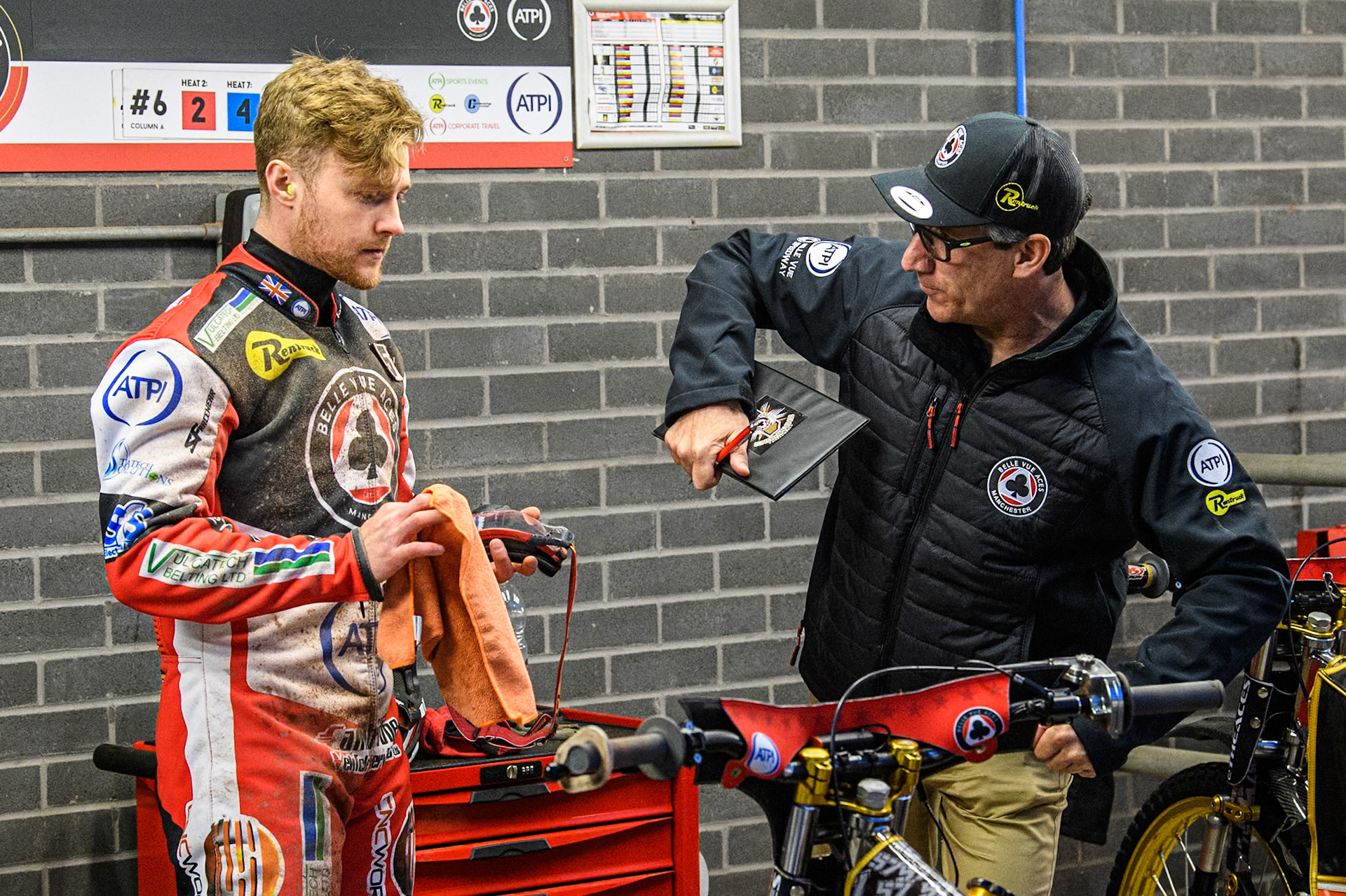 Belle Vue Aces' Team Manager Mark Lemon (Right) gives some advice to Belle Vue Aces' Connor Mountain during the Rowe Motor Oil Premiership match between Belle Vue Aces and Ipswich Witches at the National Speedway Stadium, Manchester on Monday 22nd April 2024. (Photo: Ian Charles | MI News)