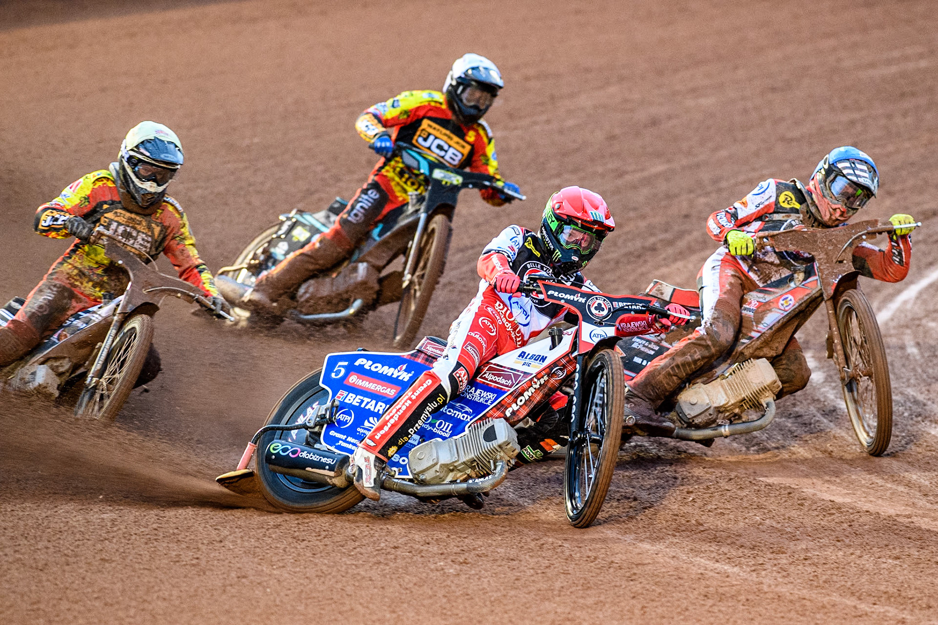 Dan Bewley of Belle Vue Aces in Red and Connor Bailey of Belle Vue Aces in Blue go for maximum points over Joe Thompson of Leicester Lions in Yellow and Ryan Douglas of Leicester Lions in White during the Rowe Motor Oil Premiership match between Belle Vue Aces and Leicester Lions at the National Speedway Stadium, Manchester on Saturday 6th April 2024. (Photo: Ian Charles | MI News)