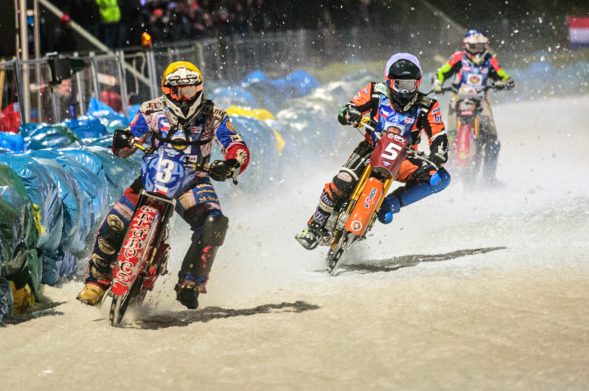 Jan Klatovsky (Yellow) leads Lukas Hutla (White) and Harald Simon (Blue) in the last chance heat during the German Individual Ice Speedway Championship at Horst-Dohm-Eisstadion, Berlin on Friday 3rd March 2023. (Photo: Ian Charles | MI News)