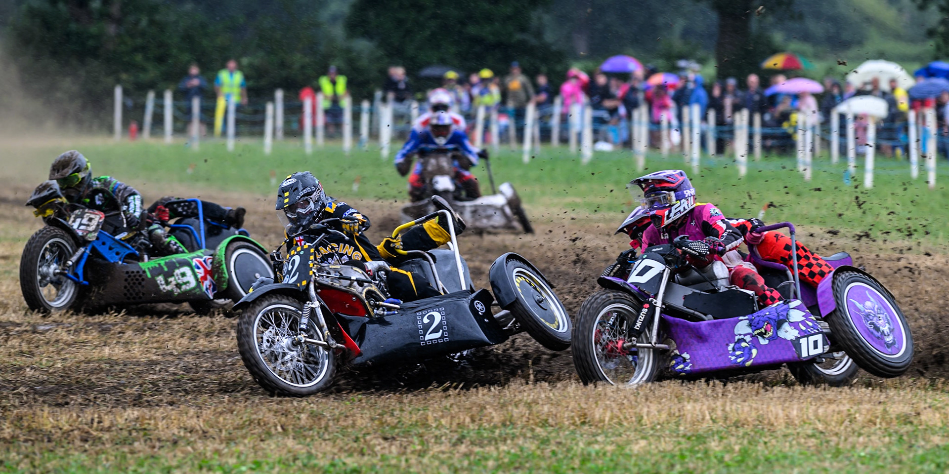 Steve Smith &amp; passenger (2) on the inside if Clint Blondel and Reece Blondel (10) with Billy Winterburn and Bradley Sheils (49) on their inside in the 1000cc Sidecar class during the ACU Northern Grass Track Riders Championship at Cheshire Grass Track Club, Frog Lane, Knutsford, Cheshire on Sunday 20th July 2025. (Photo: Ian Charles | MI News)