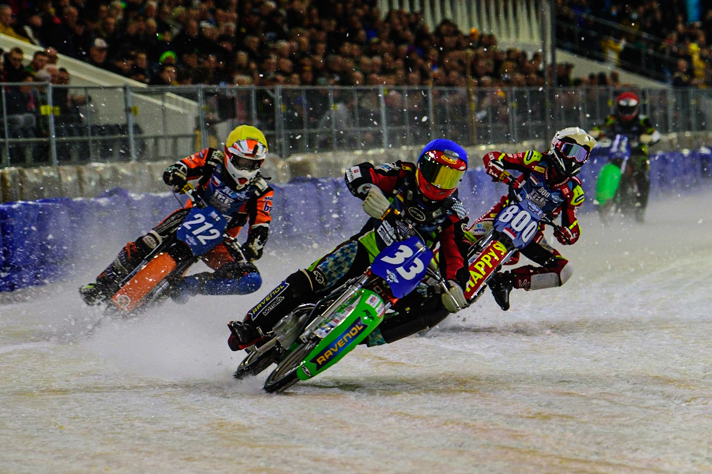 HEERENVEEN, NL.  Johann Weber (33)  leads Lukas Hutla (212) (Yellow) and Jasper Iwema (800) during the FIM Ice Speedway Gladiators World Championship Final 4 at Ice Rink Thialf, Heerenveen on Sunday  3 April 2022. (Credit: Ian Charles | MI News)