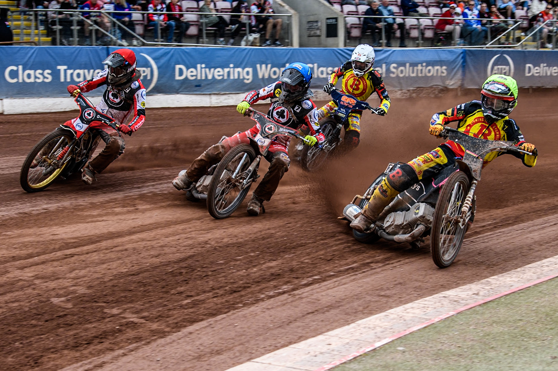 Birmingham Brummies' Leon Flint  in Yellow rides inside Belle Vue Aces' Connor Bailey  in Blue and Belle Vue Aces' Norick Blödorn  in Red with Birmingham Brummies' Steve Worrall  in White behind during the Rowe Motor Oil Premiership match between Belle Vue Aces and Birmingham Brummies at the National Speedway Stadium, Manchester on Monday 6th May 2024. (Photo: Ian Charles | MI News)