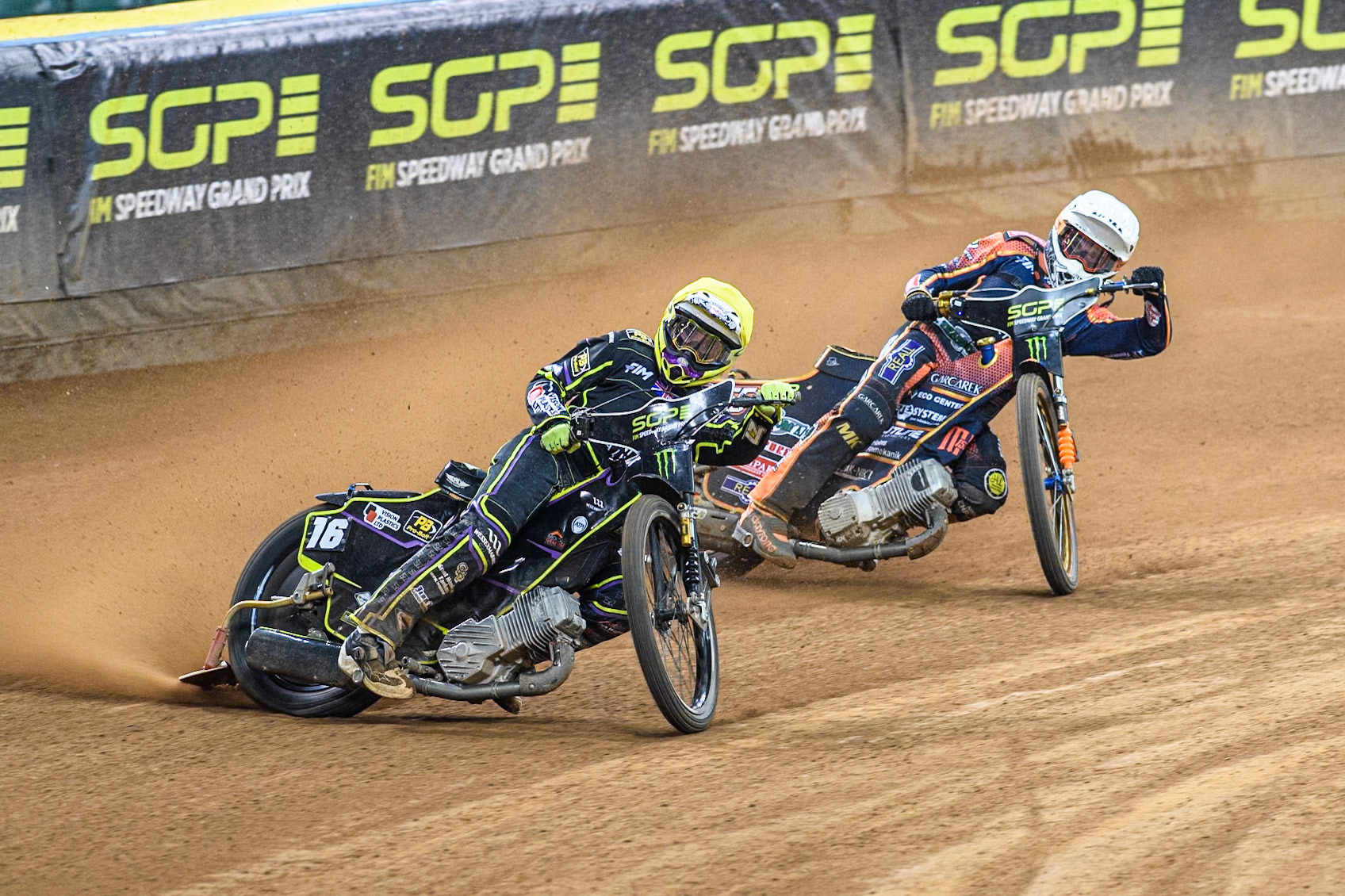 Tom Brennan (16) Wild card rider of Great Britain in Yellow leading Mikkel Michelsen (155) of Denmark in White during the FIM Speedway Grand Prix of Great Britain at The Principality Stadium, Cardiff on Saturday 17th August 2024. (Photo: Ian Charles | MI News)