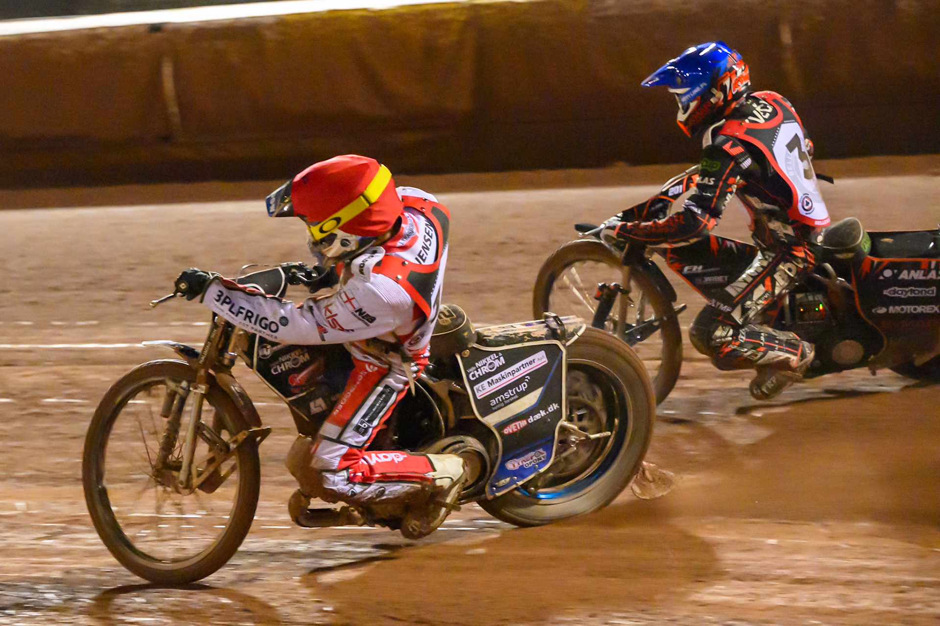 Rasmus Jensen  in Red rides inside Jan Kvech  in Blue during the Peter Craven Memorial Trophy at the National Speedway Stadium, Manchester, on Monday 16th March 2026. (Photo: Ian Charles | MI News)