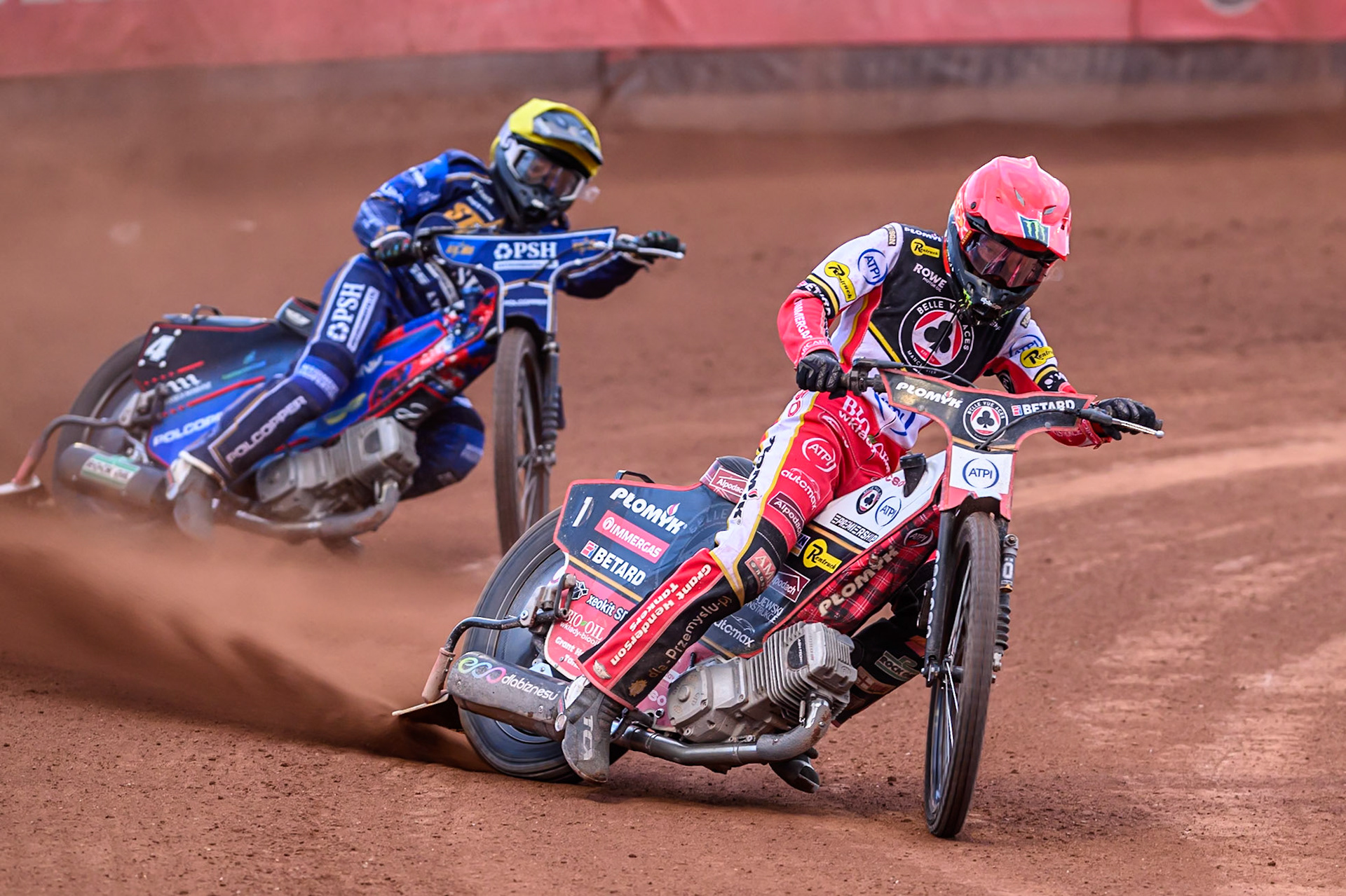 Belle Vue Aces' Dan Bewley in Red leading Kings Lynn Stars' Ben Cook in Yellow during the Rowe Motor Oil Premiership match between Belle Vue Aces and King's Lynn Stars at the National Speedway Stadium, Manchester on Monday 23rd June 2025. (Photo: Ian Charles | MI News)