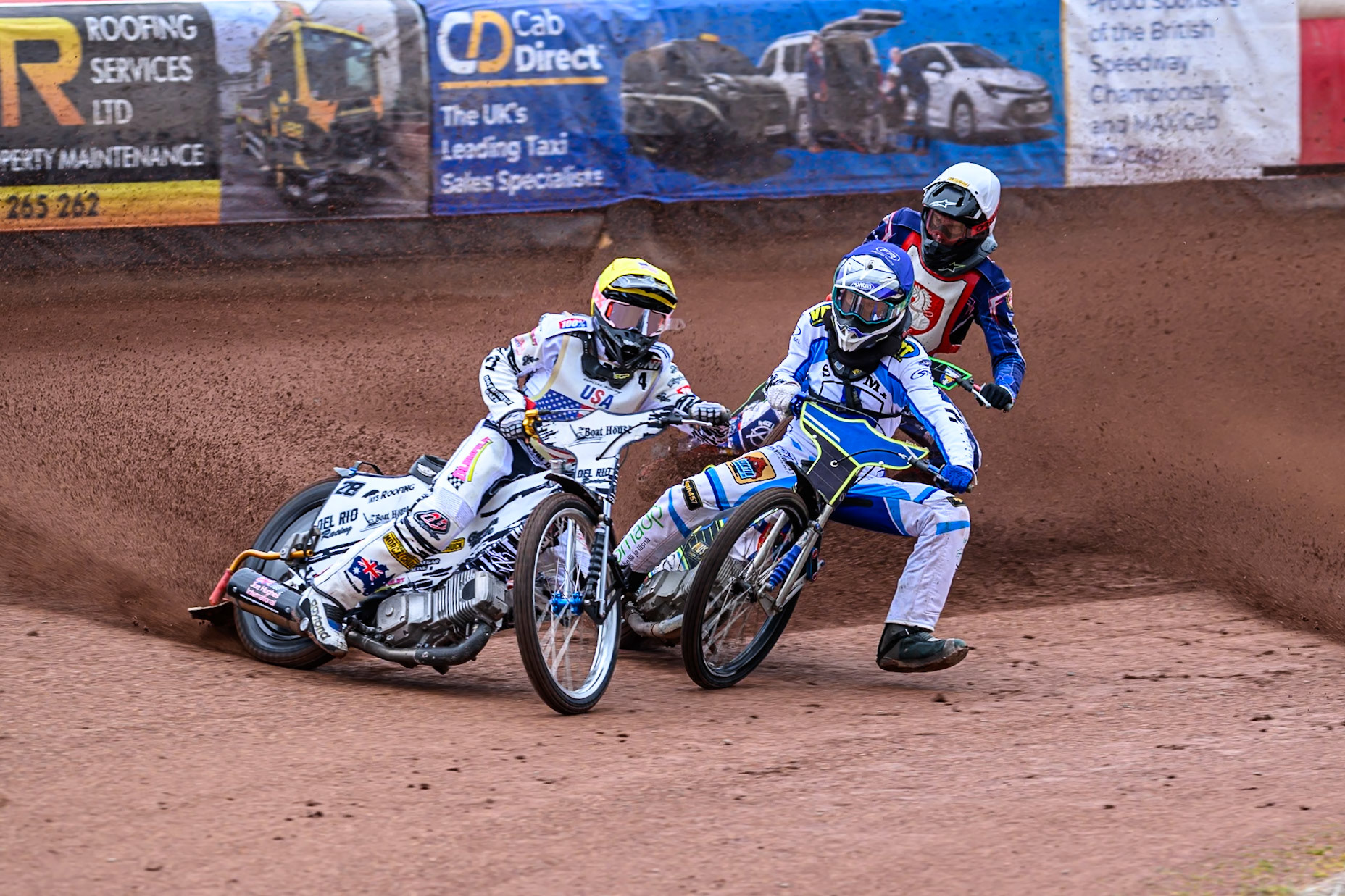Slater Lightcap of The United States in Red leading Otto Raak of Finland in Blue with Jan Jenicek of Czechia in White behind during the FIM SGP2 Qualifying Round at the Peugeot Ashfield Stadium in Glasgow on Saturday 24th May 2025. (Photo: Ian Charles | MI News)