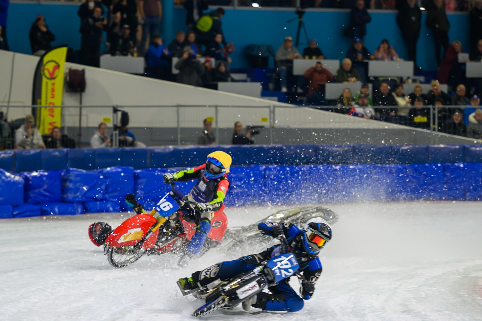 Heikki Huusko (67) of Finland  collides with Wild Card Harald Simon (16) of Austria in Yellow in the first turn during the FIM Ice Speedway Gladiators World Championship Final 3 at Ice Rink Thialf, Heerenveen on Saturday 11th April 2026. (Photo: Ian Charles | MI News)