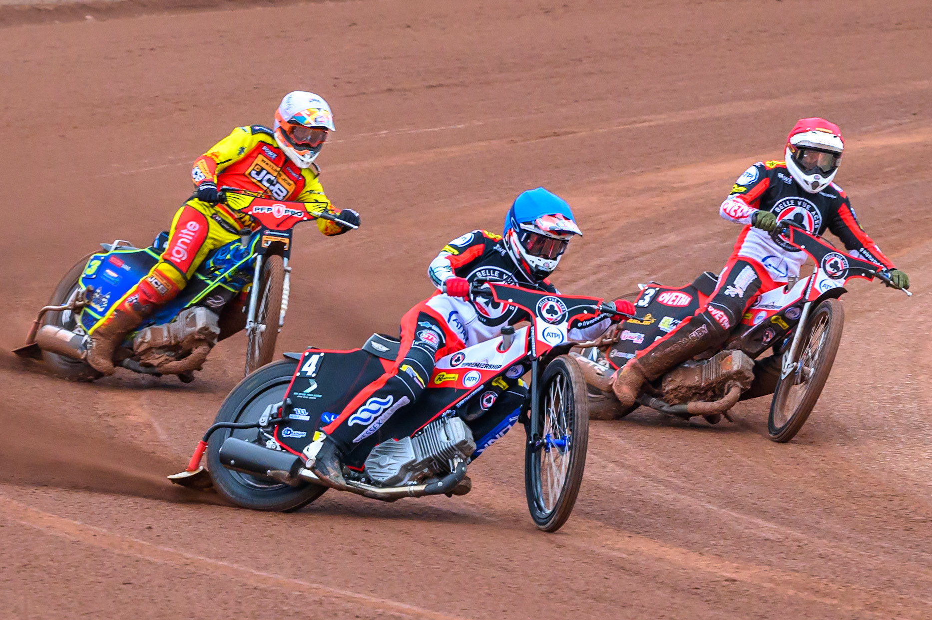 Zach Cook of Belle Vue Aces in Blue leading Peter Kildemand of Belle Vue Aces in Red and Nick Morris of Leicester Lions in White during the Rowe Motor Oil Premiership match between Belle Vue Aces and Leicester Lions at the National Speedway Stadium, Manchester on Monday 15th June 2026. (Photo: Ian Charles | MI News)