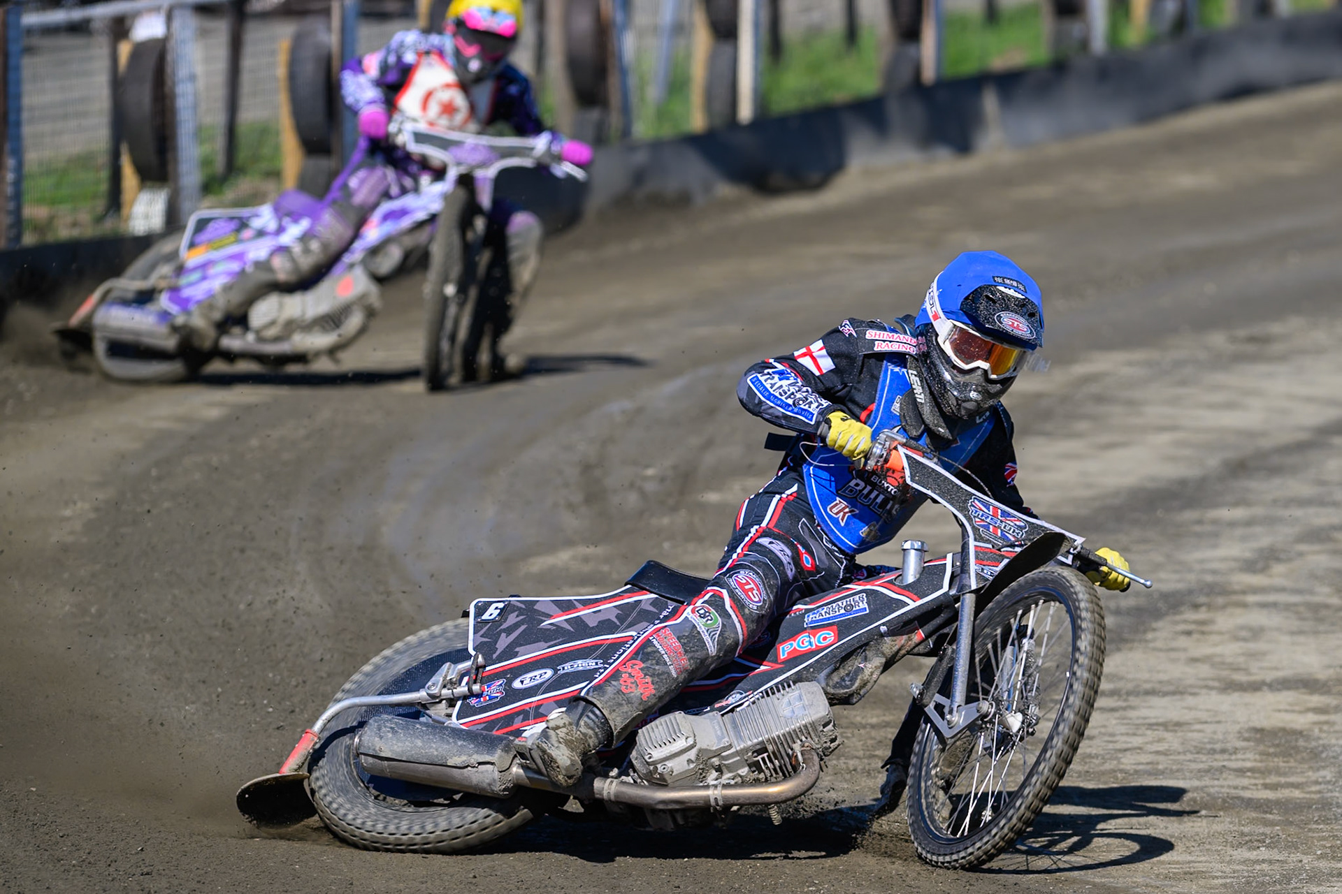 Jack Shimelt of Buxton Bulls in Blue leading Max Broadhurst of Stoke Potters in Yellow during the National Development League Challenge match between Buxton Bulls and Stoke Potters at Hi-Edge Speedway, Buxton on Sunday 24th May 2026. (Photo: Ian Charles | MI News)