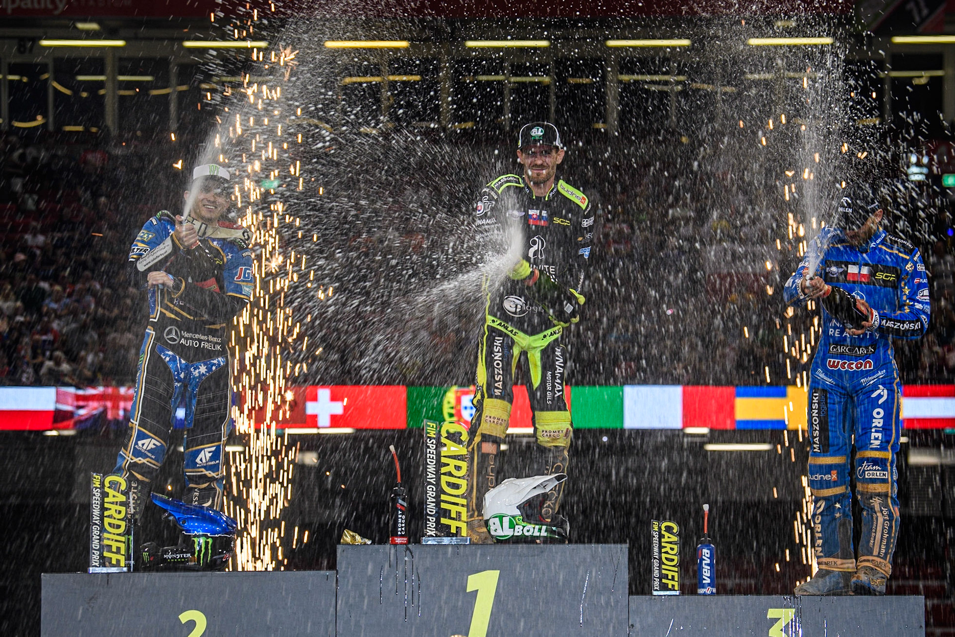 The Champagne is sprayed liberally by the Top 3 during the FIM Speedway Grand Prix of Great Britain at the Principality Stadium, Cardiff on Saturday 2nd September 2023. (Photo: Ian Charles | MI News)