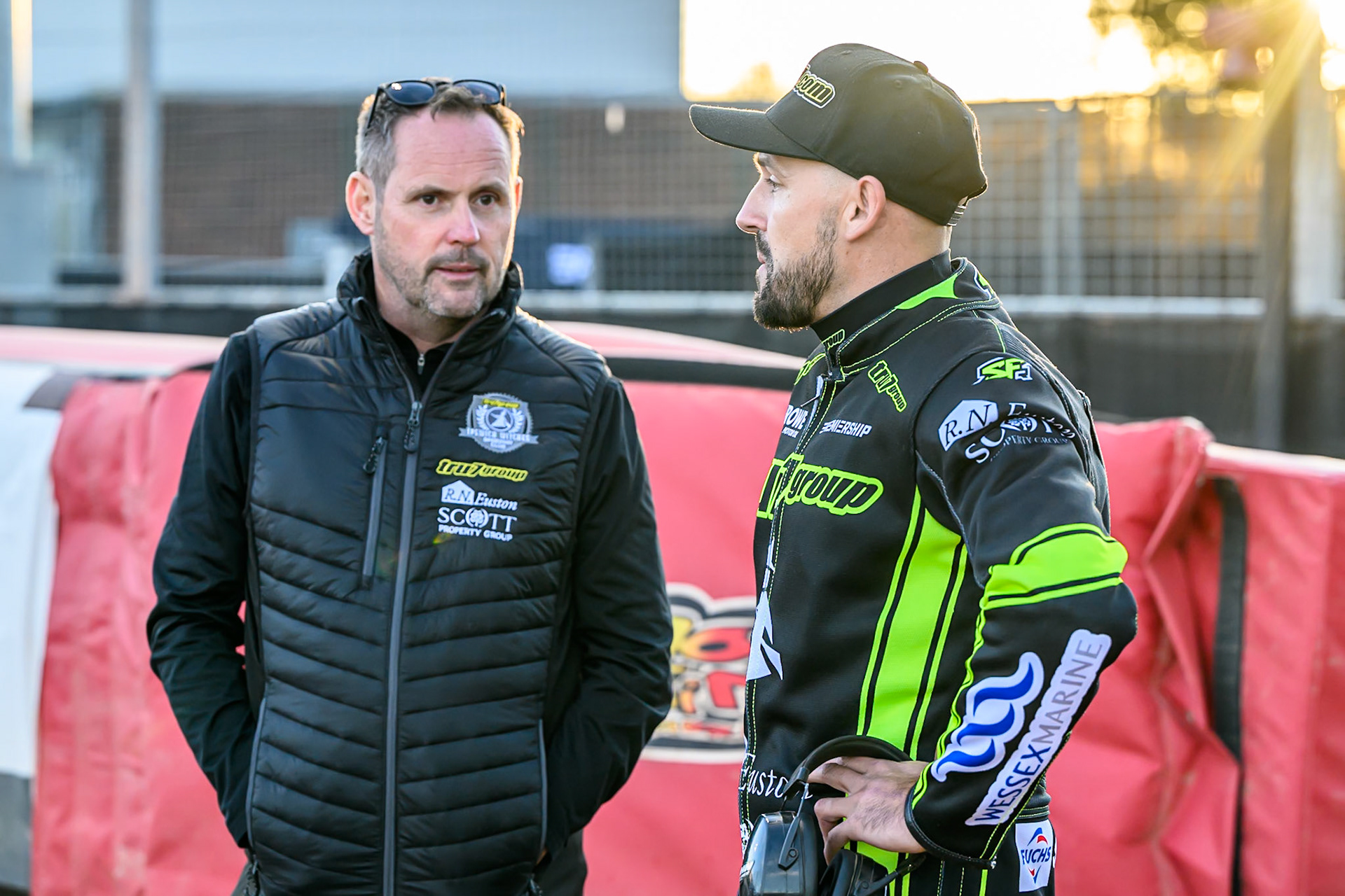 Ipswich Promoter Chris Louis (Left) chats with Danny King of Ipswich Witches during the Rowe Motor Oil Premiership Play Off Semi Final 1 (1st Leg)  between Belle Vue Aces and Ipswich Witches at the National Speedway Stadium, Manchester on Monday 8th September 2025. (Photo: Ian Charles | MI News)