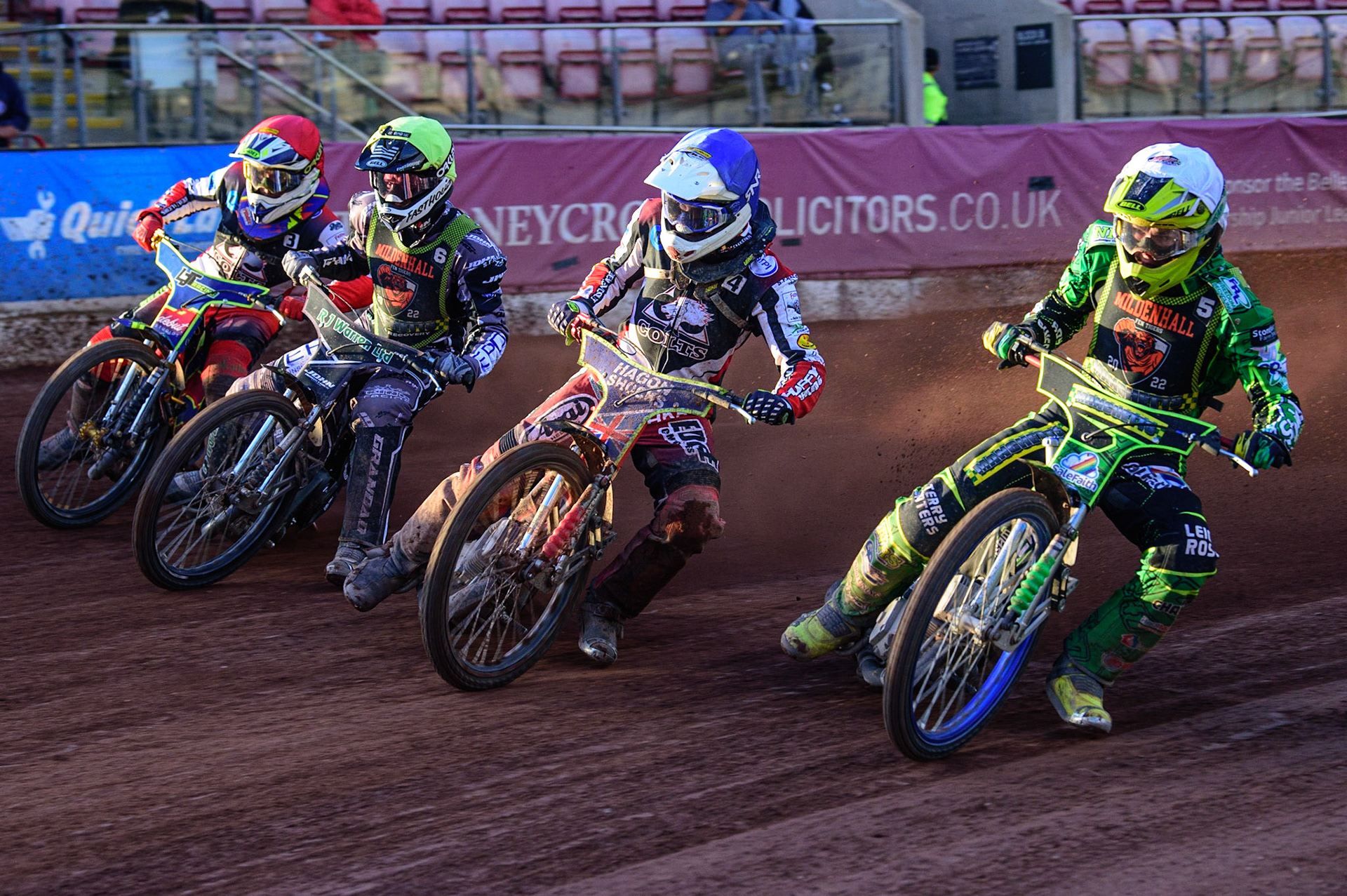 (l - r) Sam Bebee  (White), Jake Mulford (Blue) Josh Warren  (Yellow) and Nathan Ablitt   (Red) hit the first turn during the National Development League match between Belle Vue Colts and Mildenhall Fens Tigers at the National Speedway Stadium, Manchester on Friday 15th July 2022. (Credit: Ian Charles | MI News)